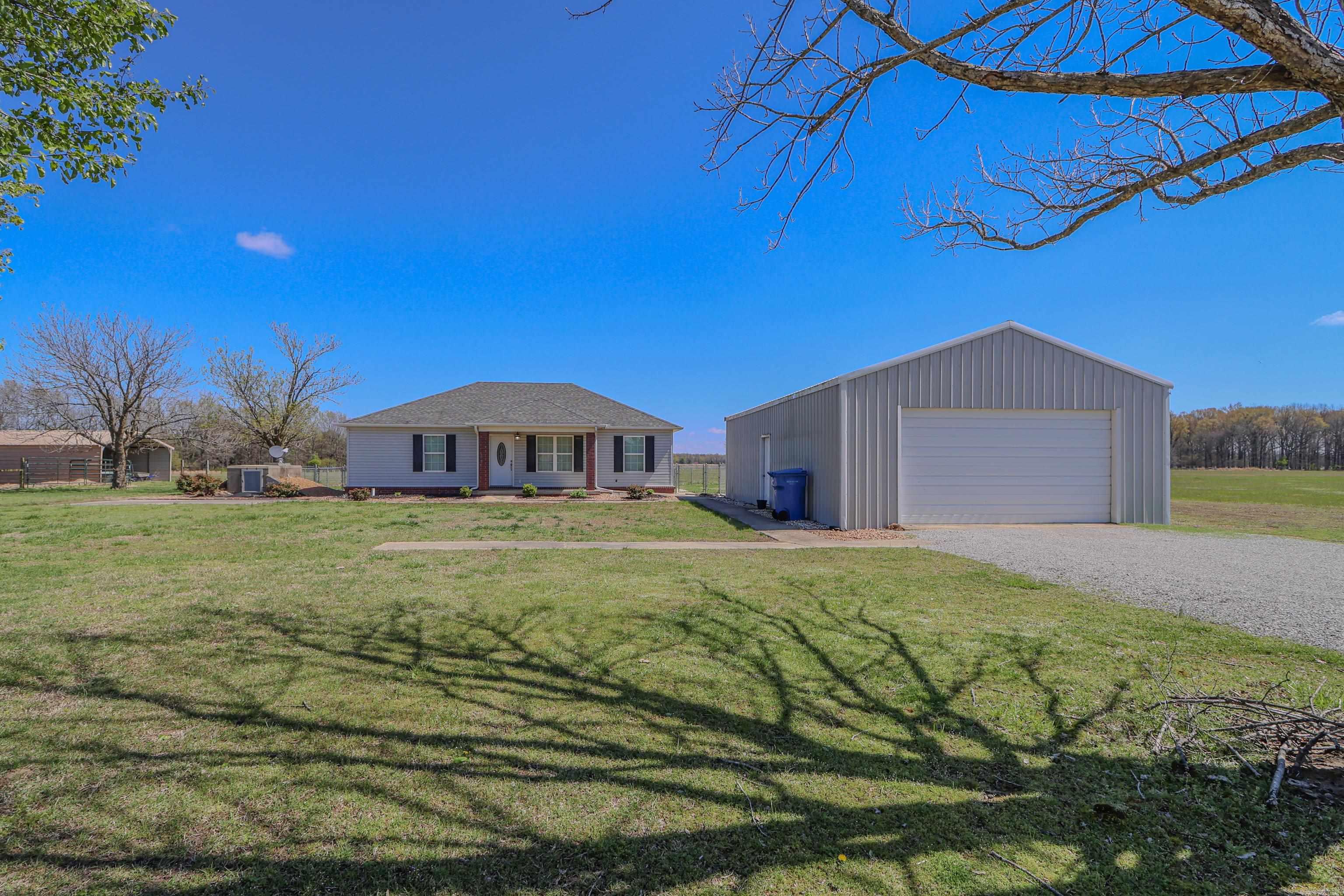 Discover the allure of this captivating newer residence nestled on 34.3 acres of picturesque land. Embrace the modern comforts of a spacious granite kitchen, complemented by a versatile flex room and a large walk-in laundry room for added convenience. Experience the harmony of indoor-outdoor living with cross-fenced grounds, barns, and a well-equipped shop, all while ensuring safety and peace of mind with a dedicated storm shelter.