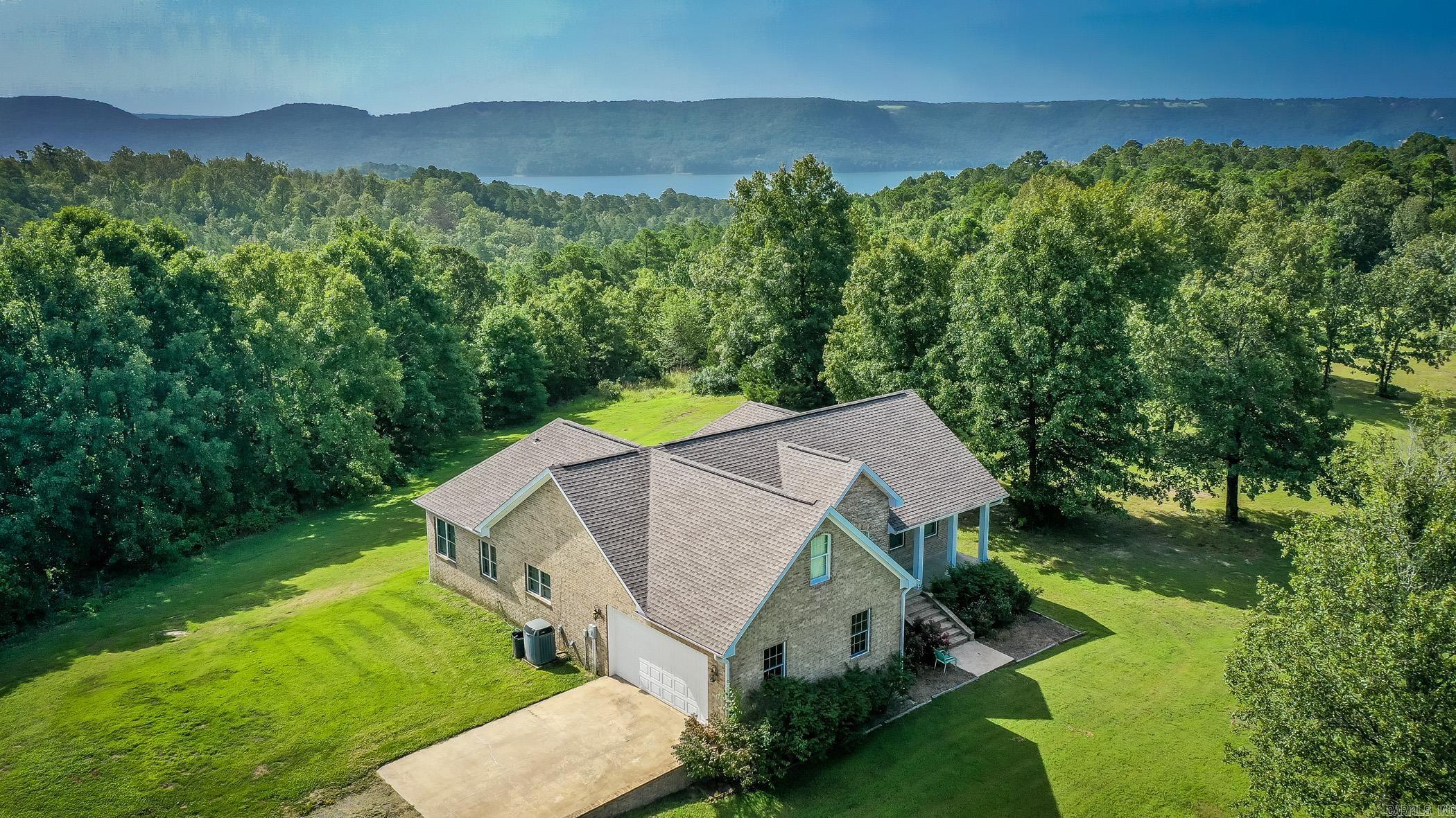 This is a beautiful 3 bedroom, 2 bath home located only a few short minutes from Greers Ferry Lake.  Upstairs, you will find a spacious "extra room" and the roof and water heater are both only 1 year old.  It also has a spacious 2 car garage with large covered carport just off to the side for your boat/utv storage.  There are 2 public boat ramps less than 5 min from the house and FFB Marina is less than 15 minutes away.  You will also be close to 2 of the best public golf courses in the state with a seasonal view of Greers Ferry Lake.