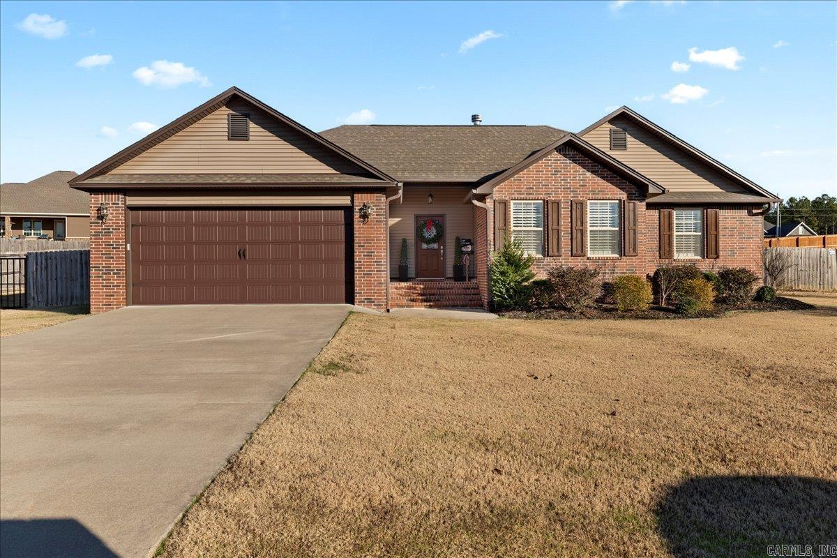 WOW describes vaulted ceiling in family room w/fireplace. In the large open kitchen & dining spaces,there's room for ALL the family! Custom cabinets,granite countertops,pantry. SO MUCH NATURAL LIGHT EVERYWHERE. Master suite-so nice! Tiled shower, separate jetted tub, walk-in closet.2 guestrooms share 2nd bath. Private laundry. Backpack area at garage foyer. Porch is tiled (:-),view is privacy fenced backyard with black metal gate.THIS HOME IS IMMACULATE!