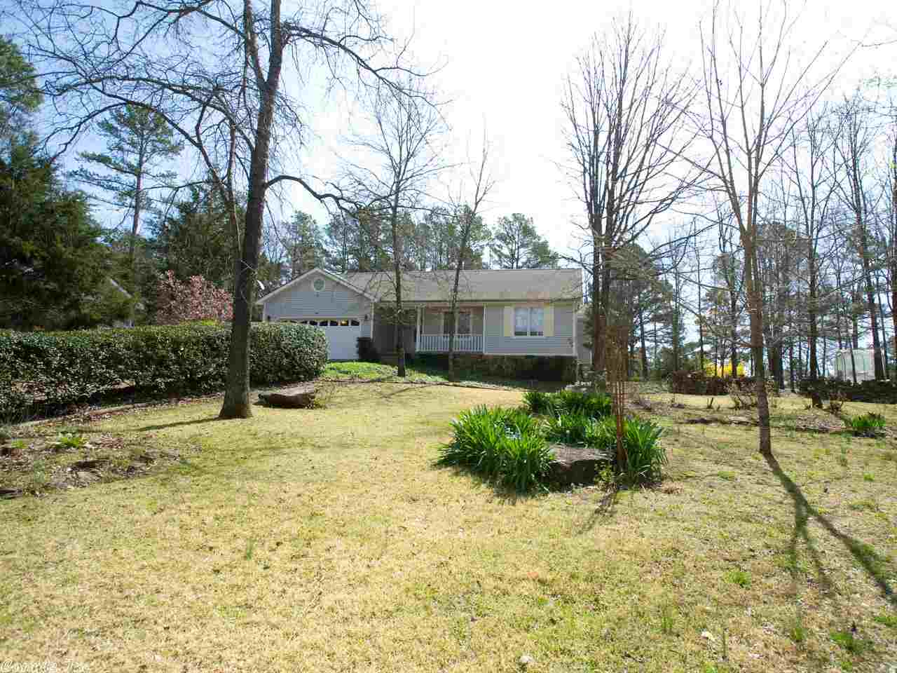 GREAT PRICE & HOME WARRANTY!!! Come enjoy living the Golfer's Dream in Fairfield Bay on beautiful Mountain Ranch Golf Course. The 7th hole is in your backyard. Greers Ferry Lake & Ozark Mountains are all around you.  This home has the perfect setting being the only house in the cul-de-sac & close to Hwy 16. It features a beautiful fire place with vaulted ceilings in the Great room.  Enjoy the backyard & the golfer's passing from your patio. There is a extra detached garage for your golf cart & tools.