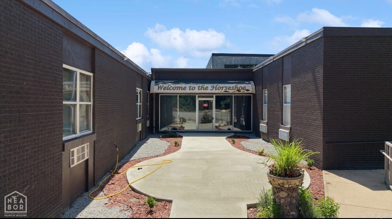Professional pics coming soon. Welcome to 1405 Hospital Dr in the historic town of Pocahontas! This unique property offers approximately 46,360 square feet sitting on 6.32 acres and is packed with opportunity. Currently featuring an 90-110 seat event center, 47 beds Airbnb space, and a partially unfinished project, the possibilities for future development are endless. Whether you're looking to expand the existing hospitality business, create affordable housing, develop a hunting lodge retreat, or transform the property into a mixed-use investment, this property has the space and location to make it happen. Pocahontas continues to see a need for additional affordable housing, while also attracting outdoor enthusiasts thanks to its close proximity to the Pocahontas Bridge and excellent hunting opportunities nearby. Positioned on a hill, the property also offers peace of mind with reduced flood concerns. This is a rare chance to invest in a large-scale property with incredible potential in a growing and historic community.