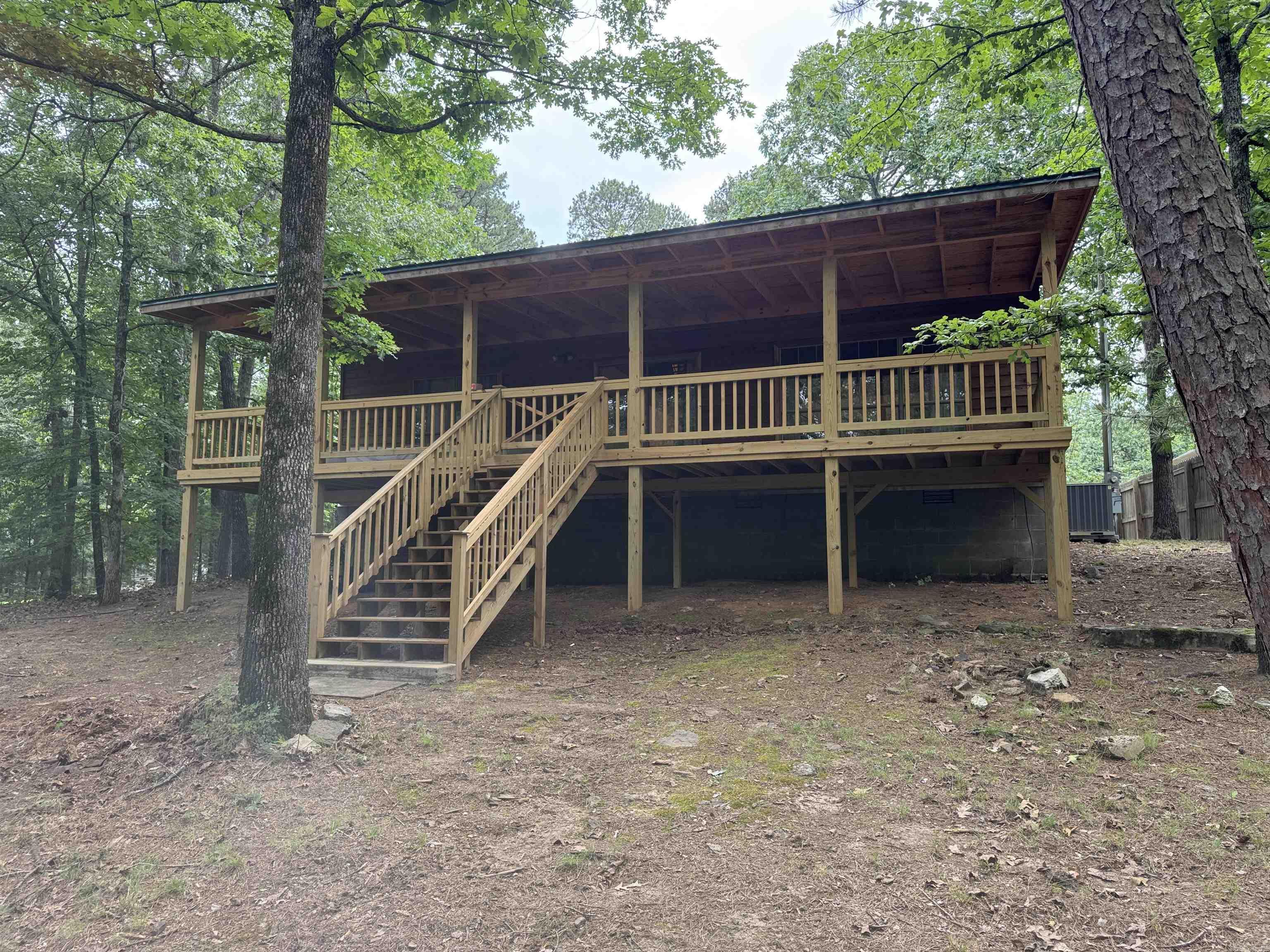 Very well kept Lake front home. Fully furnished ready to move in! Ride the Side x Side or golf cart on path to water. Enjoy relaxing or entertaining friends on the beautiful back deck. Property includes RV hook up for family or friends. Secluded and located in nice subdivision and quiet neighborhood. Less than 5 mins to Mill Creek boat launch. Would make great full time or weekend home. Drive by and give us a call today.