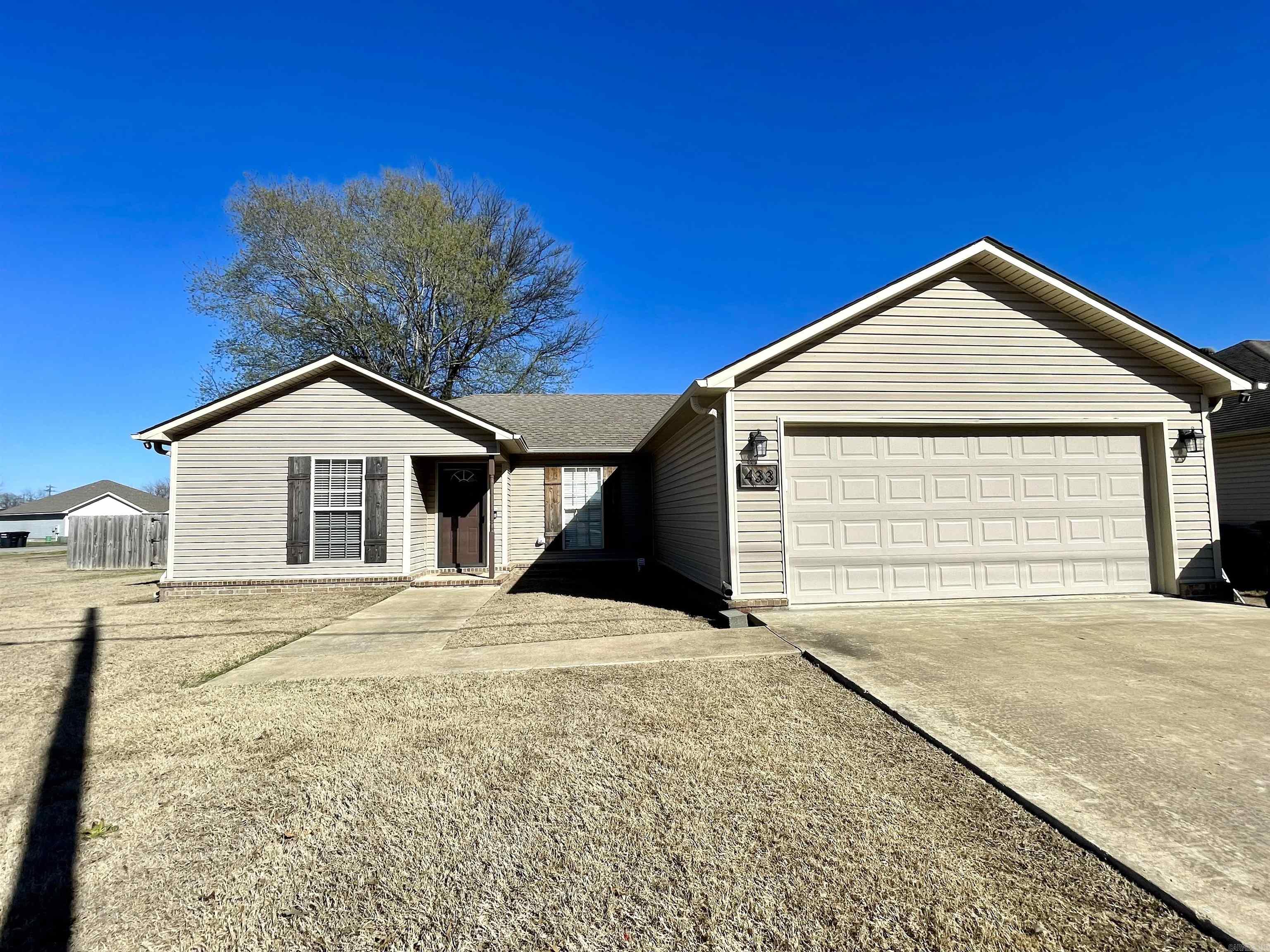 Cute and convenient location in Trumann, Arkansas. Just 15 minutes to Jonesboro and 45 minutes to Memphis. This 3 bedroom, 2 bath home is all electric and low maintenance with vinyl siding on a slab foundation. There is a 2 car garage, fenced backyard, back patio, and it's on a large corner lot (0.27 acres). The primary suite is laid out well with a large walk in closet. One of our favorite things about this home is that the kitchen and open dining are at the back of the home with views to the fenced backyard. Schedule your private tour with your favorite REALTOR® and make this house your own!