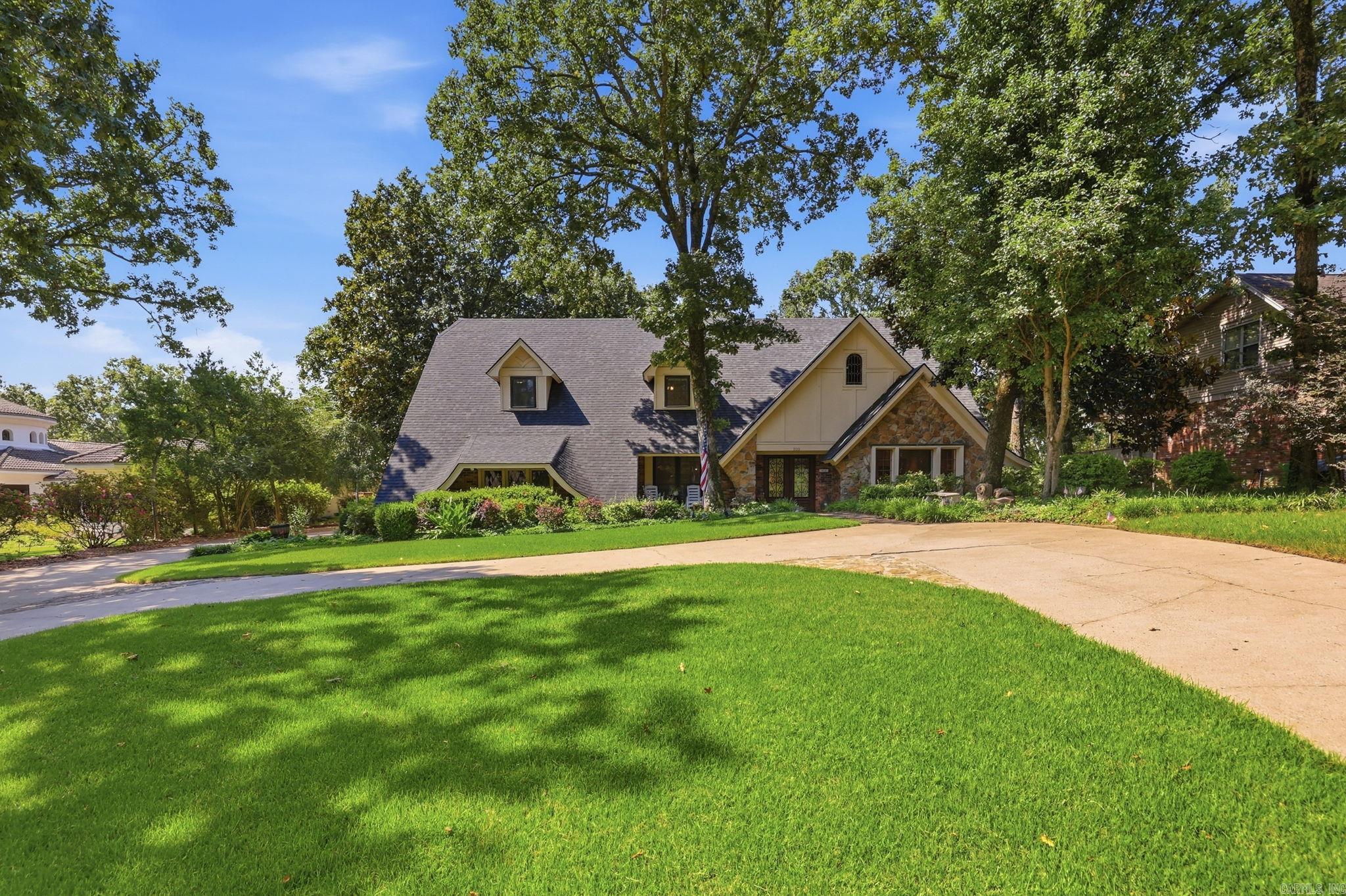 Tucked away in sought-after Shady Valley, this one-of-a-kind property offers privacy, charm, and space rarely found on the market. The level lot backs to a 5-mile creek, framed by picturesque tree house views, while tiered decks and lush landscaping along with an in-ground trampoline and fenced yard create an inviting outdoor retreat. Inside, fresh paint and generous living areas welcome you home, with a flexible downstairs space suited for formal dining or formal living room and another room perfect for an office. The kitchen impresses with granite counters, a center island, double ovens, and a wet bar with additional storage. The kitchen overlooks the light-filled sunroom, showcasing insulated windows, soaring ceilings, and a brick floor. Upstairs offers 4 large bedrooms with 2 full baths and large walk-in closets. No carpet! Major updates bring peace of mind: a NEW roof with a 2-year warranty, an updated 2022 HVAC system and double-hung insulated vinyl windows. Plus, this home qualifies for an assumable loan at 2.5% (subject to buyer approval). Space, character, and setting like this don't come often — schedule a showing today! Agents, see remarks for approx. loan balance.