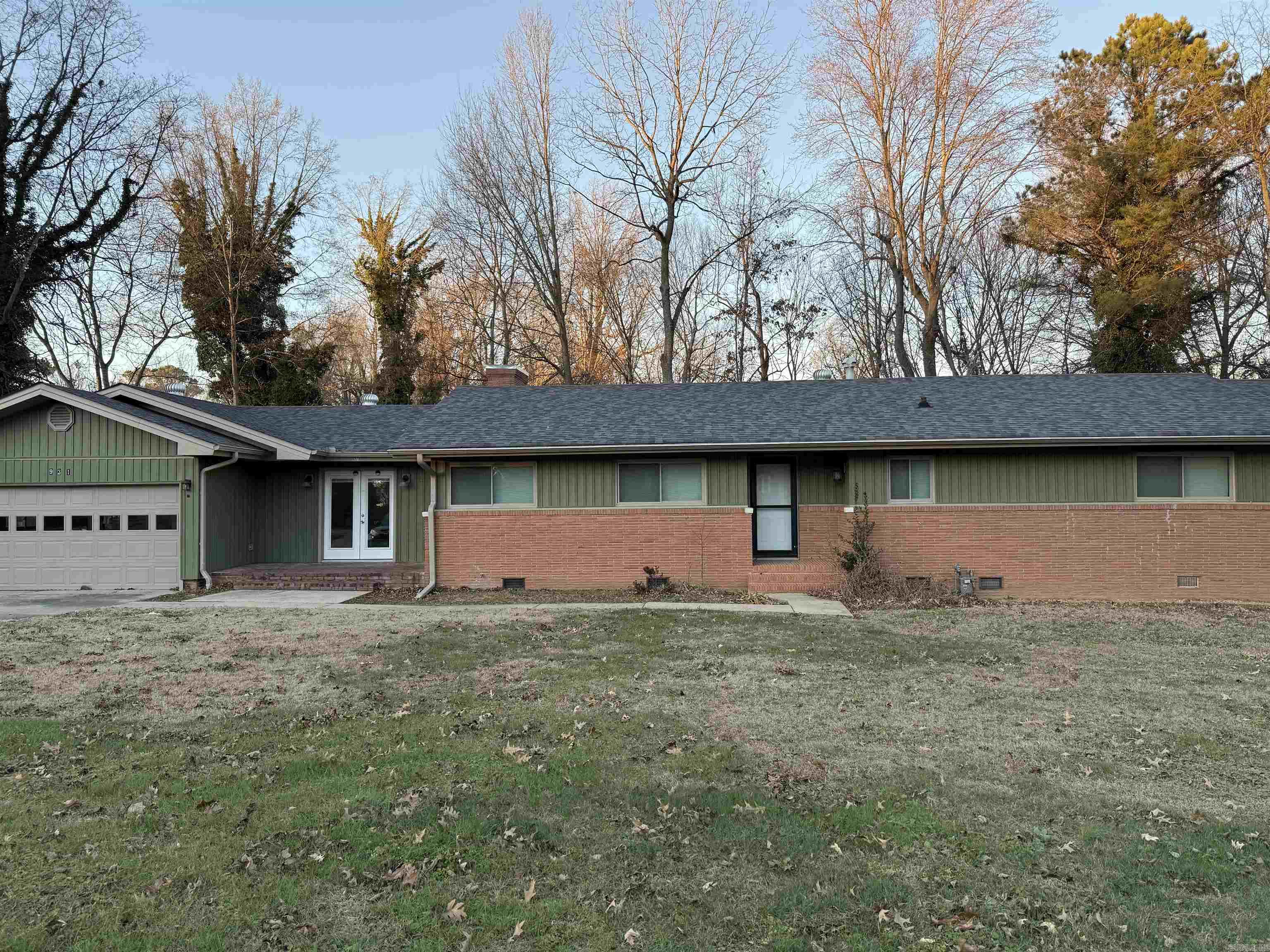 Beautiful 3 bedroom, 2 bath home located in Piggott, AR. This home has been renovated and offers open concept living with two spacious living areas with  beautiful brick fireplaces.  The kitchen, dining, living room combination has an abundance of natural light with floor to ceiling windows, and overlooks the back deck, with views of the gazebo. The bedrooms are spacious. One bedroom has built in bookcases making it a perfect home office. The master bedroom, with beautiful barn door, fandelier, has split baths, one with shower, toilet, vanity,  and the other large spa-like bath area has free standing soaking tub, and vanity area. The adjoining room has laundry room, with build in ironing board, and access to the back yard. You will fall in love with the large master closet that adjoins the master bath. This home has a built in generator for piece of mind. It has a beautiful fenced in yard with deck and gazebo.  Ok you know you want to see this house so don't wait any longer. Call today and schedule a time to see  ALL this home has to offer!