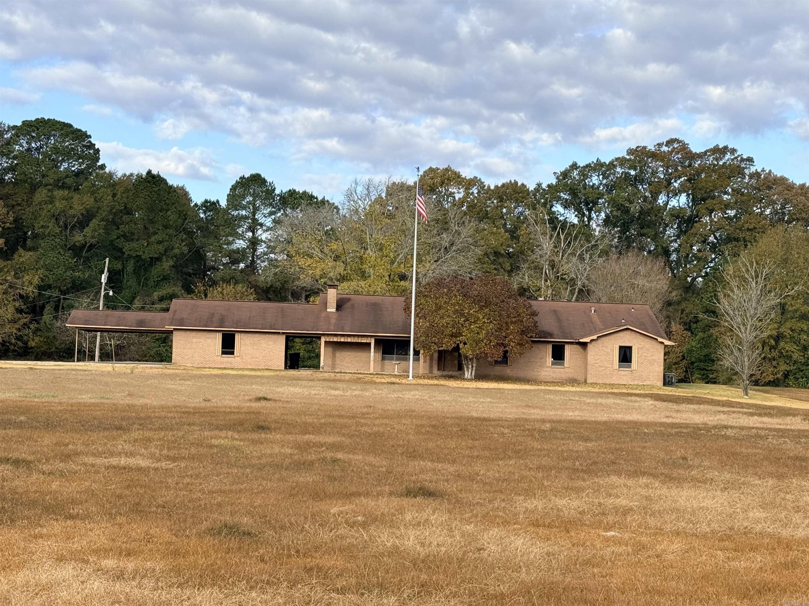 Commercial Property – Over 3,700 Sq. Ft. on 5 Acres! High-Traffic Location! Don’t miss this incredible opportunity to own a spacious brick commercial building offering over 3,700 sq. ft. of versatile space on 5 acres in a prime high-traffic area. This property is packed with features to fit a wide range of business needs! Step inside to a large lobby/reception area, perfect for greeting clients or customers. Enjoy the convenience of a full, spacious kitchen, a large laundry area with abundant storage, and multiple office spaces—up to 5 separate offices—providing room for staff, files, and equipment. The building also includes 4 full bathrooms, walk-in closets, and additional storage throughout for files, supplies, or inventory. A double carport with two large storage rooms adds even more functionality and convenience. Whether you’re expanding your current business or starting something new, this property offers the space, flexibility, and location you need! Square footage, lot size, and acreage is taken from courthouse records.