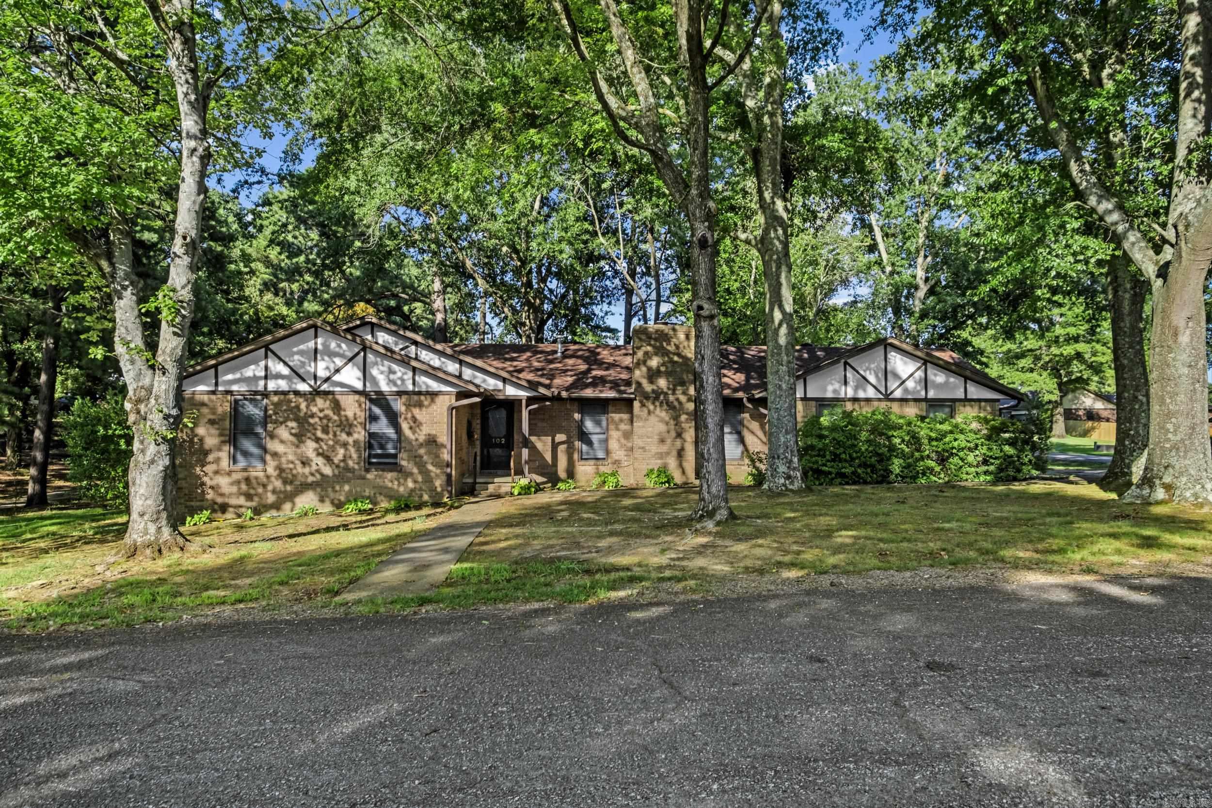 Welcome home to this beautifully maintained 3-bedroom, 2-bath home offering just under 2,000 square feet of comfortable living space in a peaceful golf course setting! Designed for both everyday living and entertaining, this home features a spacious living room centered around a cozy wood-burning fireplace, an open-concept eat-in kitchen, and a formal dining room with an adjoining sitting area or den that provides the perfect flex space for a home office, reading nook, or second living area. The fully renovated guest bathroom shines with a stylish new vanity, updated tile, and a gorgeous walk-in shower. The attached garage includes a convenient workshop, while the oversized laundry room offers plenty of additional storage space and room for an extra refrigerator or freezer. Step outside through the sliding glass doors onto the expansive deck, where you can relax and take in beautiful golf course views. A detached workshop provides endless possibilities for hobbies, crafts, storage, or parking your golf cart. This property offers the perfect blend of comfort, functionality, and scenic outdoor living! Agents see remarks