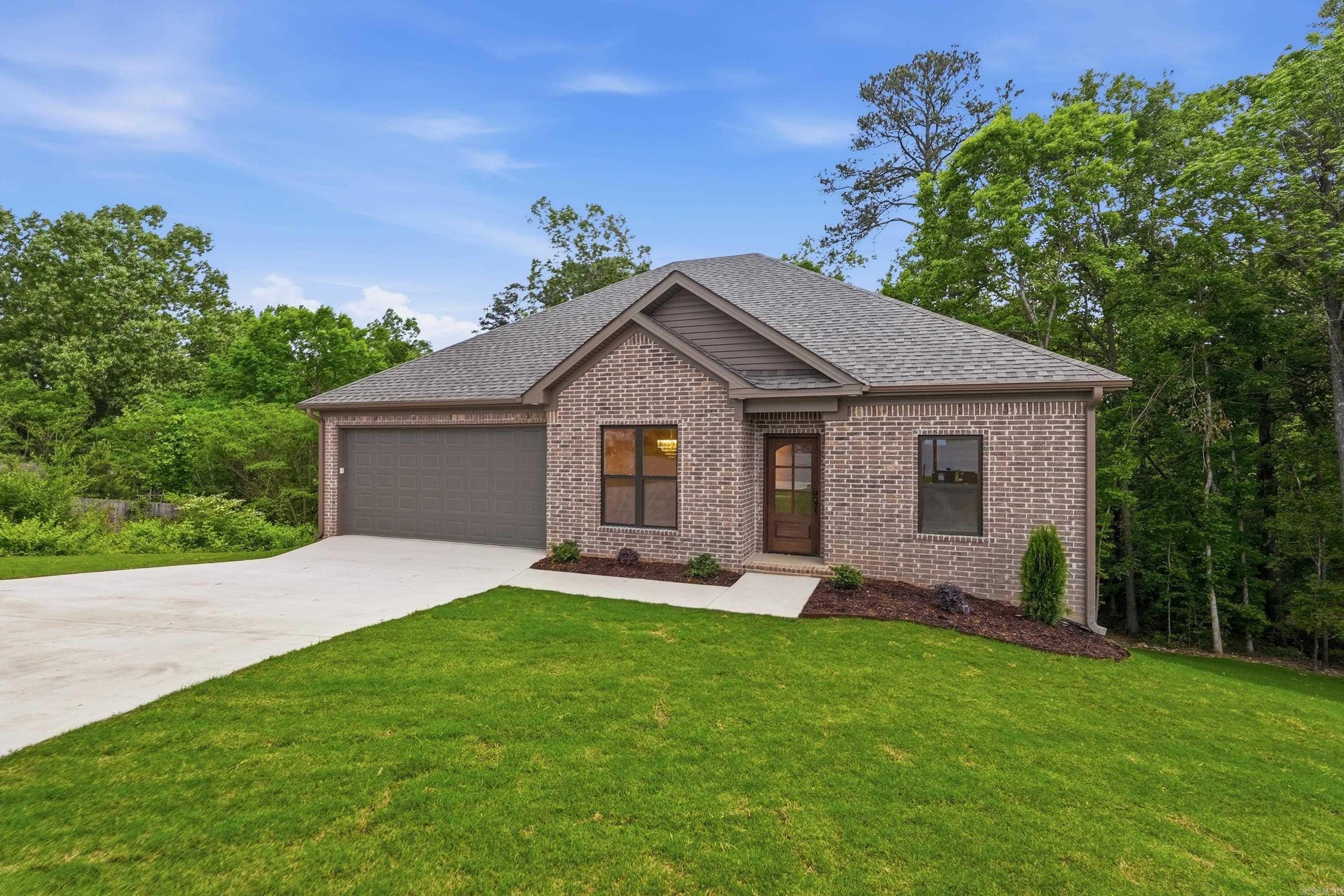 Welcome to this new construction home at 2440 Pleasant Willow Drive in Benton. This beautifully built 4 bd/ 2 bath home is tucked away on a quiet cul-de-sace and offers a serene, park-like backyard complete with a picturesque stream. Inside, you'll find an inviting open floor plan with 9' ceilings, and designer finishes throughout. The kitchen overlooks the dining & living areas, includes a breakfast bar, pantry & custom cabinetry that stretches all the way up to the ceiling. The primary suite is amply sized, features two walk-in closets & a well-appointed ensuite bath with dual sinks and tile shower. Double doors lead to the huge crawl space that offers tons of storage space. Other notable features include luxury vinyl throughout (no carpet), stainless appliances, gas range, & under cabinet lighting. This home combines comfort, style, and a peaceful setting-perfect for everyday living an entertaining alike. This is home!