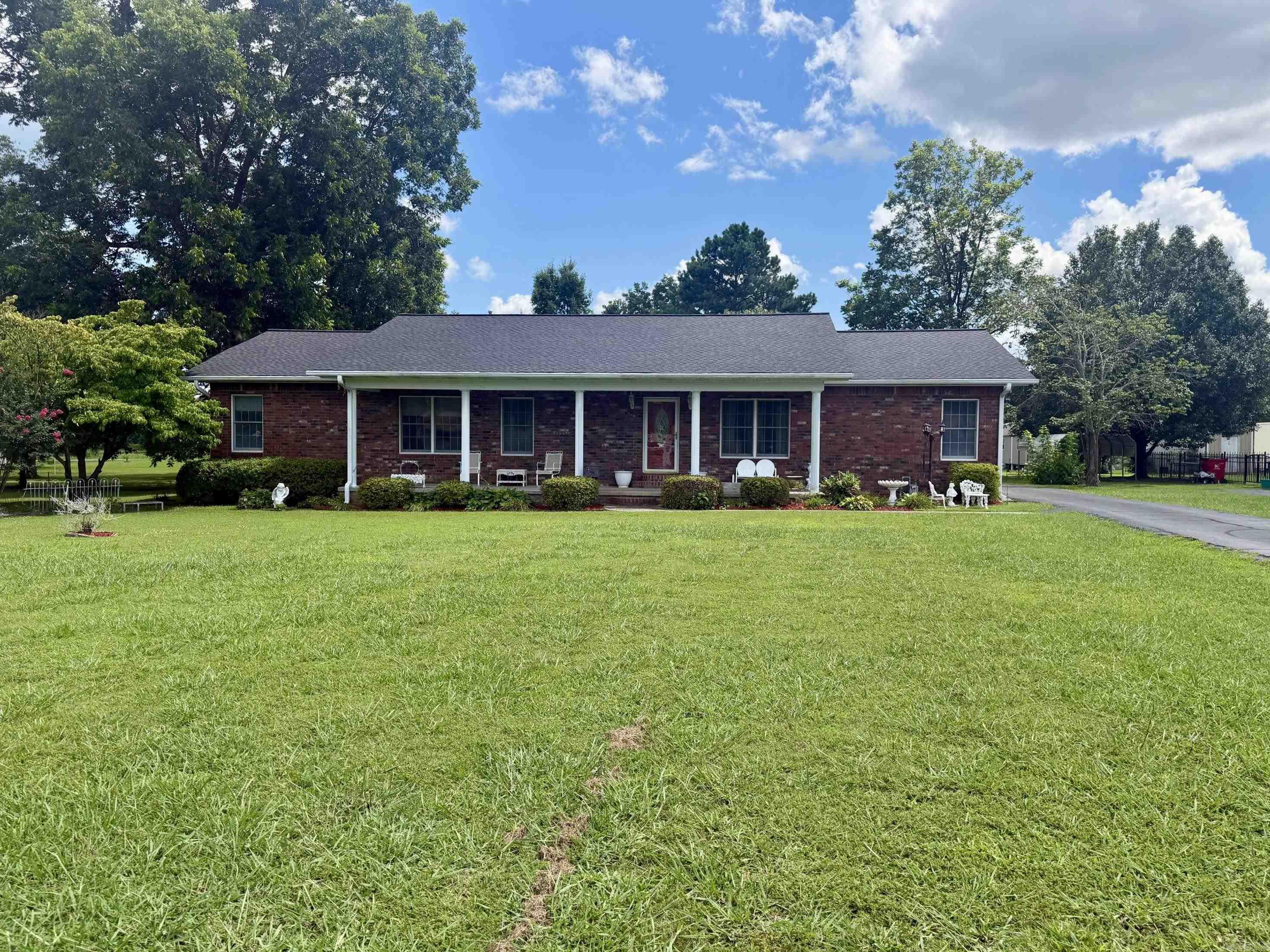Beautiful Brick Home in Cave City, Arkansas | Prime Location & Move-In Ready Welcome home to this beautifully maintained 3-bedroom, 2-bath brick home conveniently located just outside the stoplight in Cave City, Arkansas. With excellent curb appeal, blooming crape myrtles, mature landscaping, and a covered front porch, this home is warm and inviting from the moment you arrive. Inside, you'll find hardwood floors, a spacious living room filled with natural light, a dedicated dining room, and a cozy den featuring a natural gas fireplace with a beautiful brick accent wall. The kitchen offers oak cabinetry, pantry, electric range, dishwasher, refrigerator, and a stackable washer and dryer that convey. The split floor plan provides privacy with a spacious primary suite featuring a walk-in closet, vanity area, and private bath, while two additional bedrooms share an updated bathroom with a walk-in shower. Step outside to enjoy the large back deck with built-in seating, a charming gazebo, picnic area, circular driveway, and plenty of room for a garden, children, or pets. Roof less than 2 years old.Deck restrained 1 year ago.