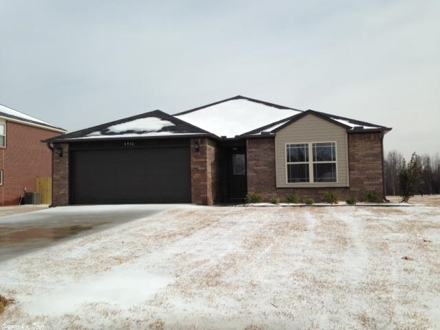 This new construction home has a split floor plan, granite counter tops, and crown molding in living area and kitchen.