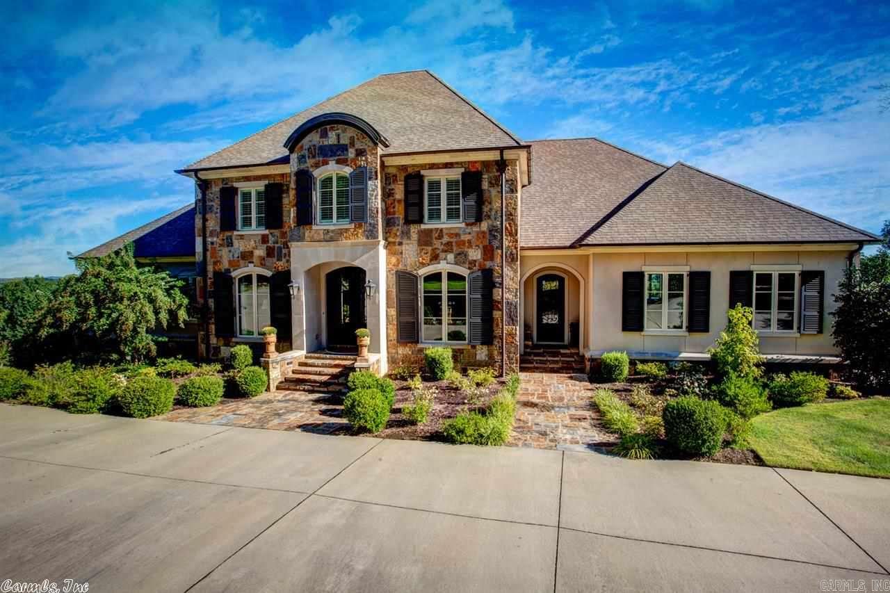 Special custom built home in a gated neighborhood.  Wonderful finish work.  Main level has Kitchen-Greatroom, master, two offices and covered masonary deck across the entire back overlooking pool and river.  Upstairs has two bedrooms and huge gameroom, media room.  Incredible storage, high ceilings, 4 car garage and more.