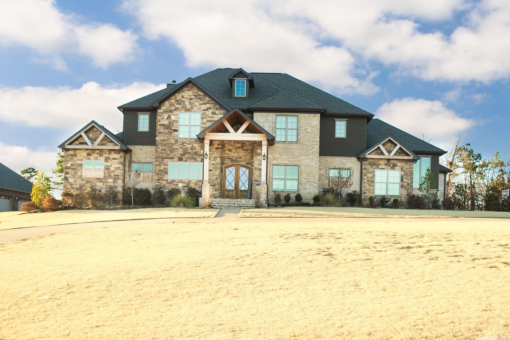 Incredible Estate on the course with fabulous views! This home offers 5 beds, 4 fulls baths, 3 car garage with extra exterior storage, inground pool with outdoor kitchen, outdoor fire pit & fireplace, oversized covered back porch, bonus room with builtins, formal office, entry locker area, custom kitchen with oversized island opens to vaulted living room with stone fireplace and cedar open shelves. Primary bedroom offers double sink vanity, separate slate shower, and jetted tub all flows into huge closet and into laundry space.