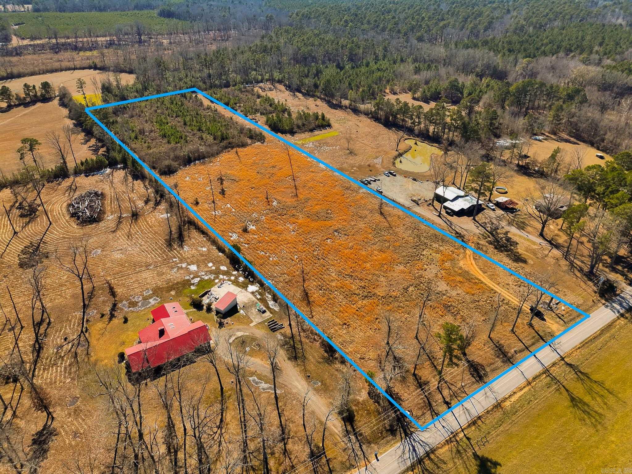 ±10 acres on Bowser Road in a desirable location just minutes from the university, hospital, schools, and city amenities. This property offers a mix of open ground and natural tree cover, allowing for a private homesite or future investment opportunity. Utilities are available, and the tract features convenient road frontage with easy access to town while still offering a quiet setting. Hard-to-find acreage in this area with long-term potential. Boundary lines are approximate and should not be considered a survey.
