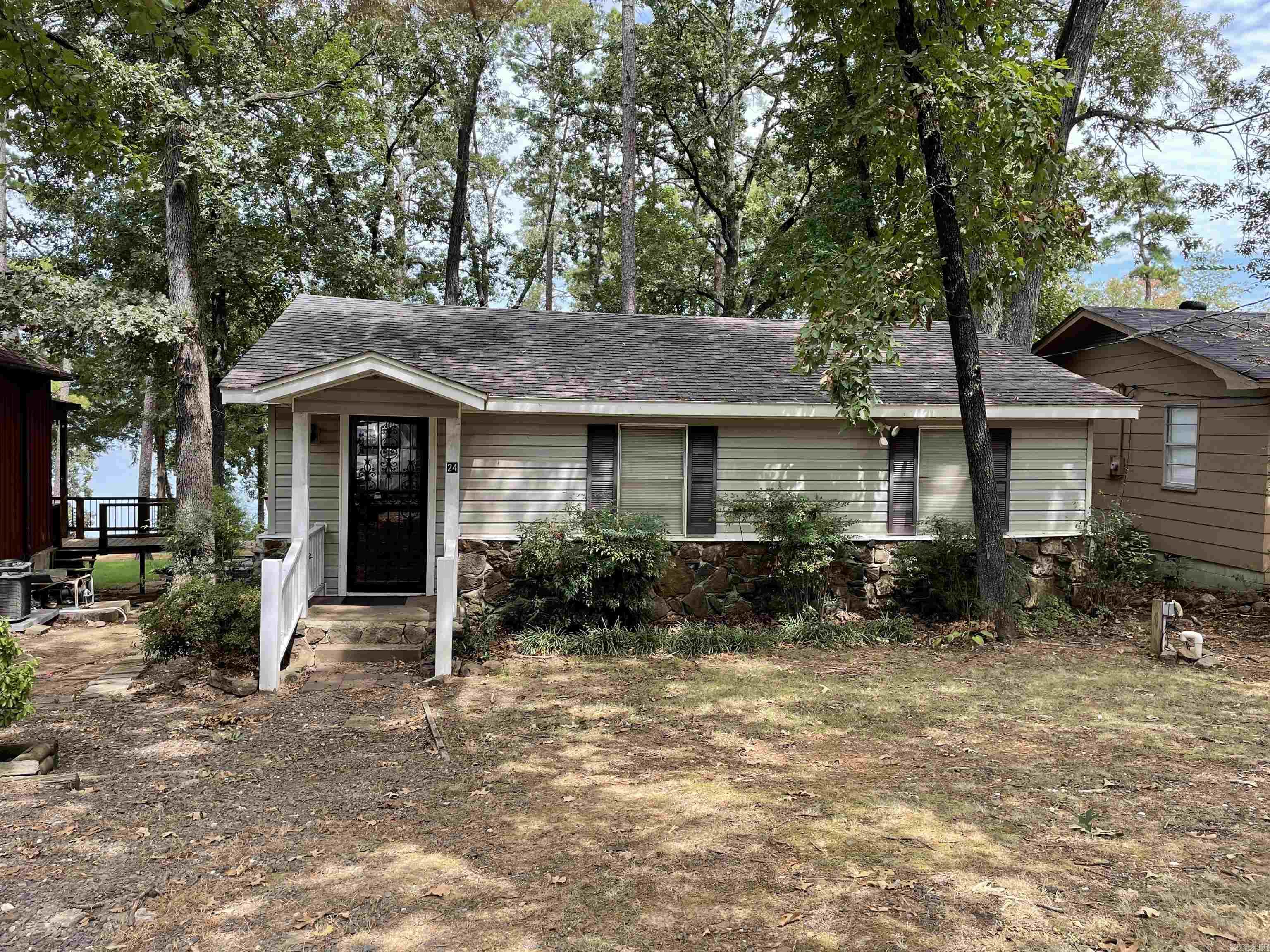 Great Lake Front Home with a Tram.  This home is located in a great neighbor hood in the old town of Higden.  Great lake access just down the road.  The tram is in good working order.  Load your boat from the deck and push a button to take you right down to the lake!!!!!
