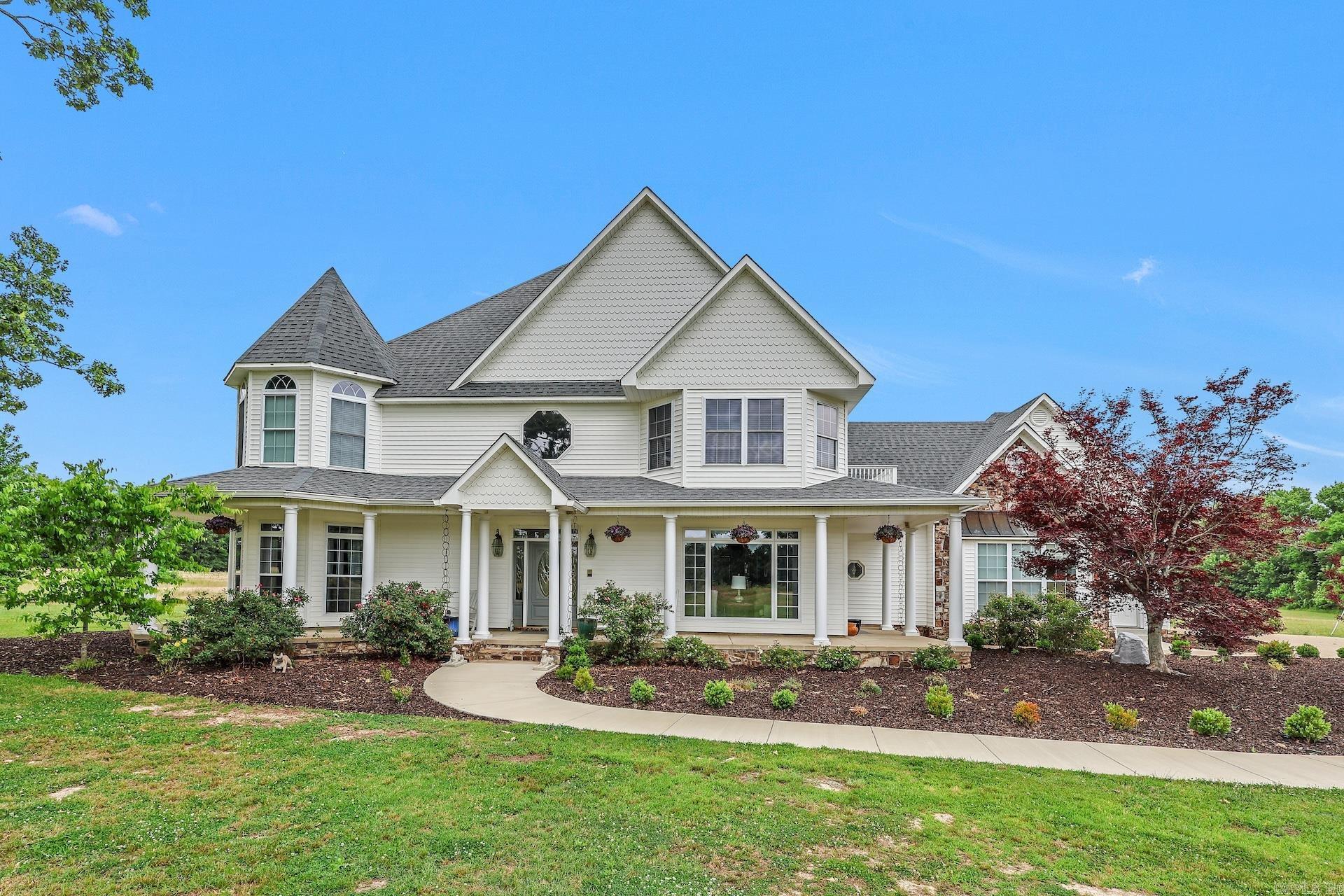 Discover the perfect combination of space, privacy, and convenience with this impressive 5,700± square foot home situated on 40± acres just outside the Arkadelphia city limits. Offering 4 bedrooms and 4.5 bathrooms, this custom home features rich hardwood flooring, soaring ceilings, detailed woodwork, and four fireplaces that add warmth and character throughout.  Designed for both comfortable living and entertaining, the home includes a dedicated office, formal dining room, and a fully equipped theater room. The spacious layout provides flexibility for a variety of needs while maintaining an inviting atmosphere.  Outside, enjoy a wraparound porch overlooking the property, an above-ground pool, and 40± acres of open possibilities. Whether you're interested in horses, cattle, recreational use, or simply enjoying the privacy of country living, this property offers ample space to make it your own.  Conveniently located just minutes from Arkadelphia, approximately 30 minutes from Hot Springs, and less than an hour from Little Rock, this exceptional property combines rural tranquility with easy access to shopping, dining, recreation, and major travel routes. Agents see remarks