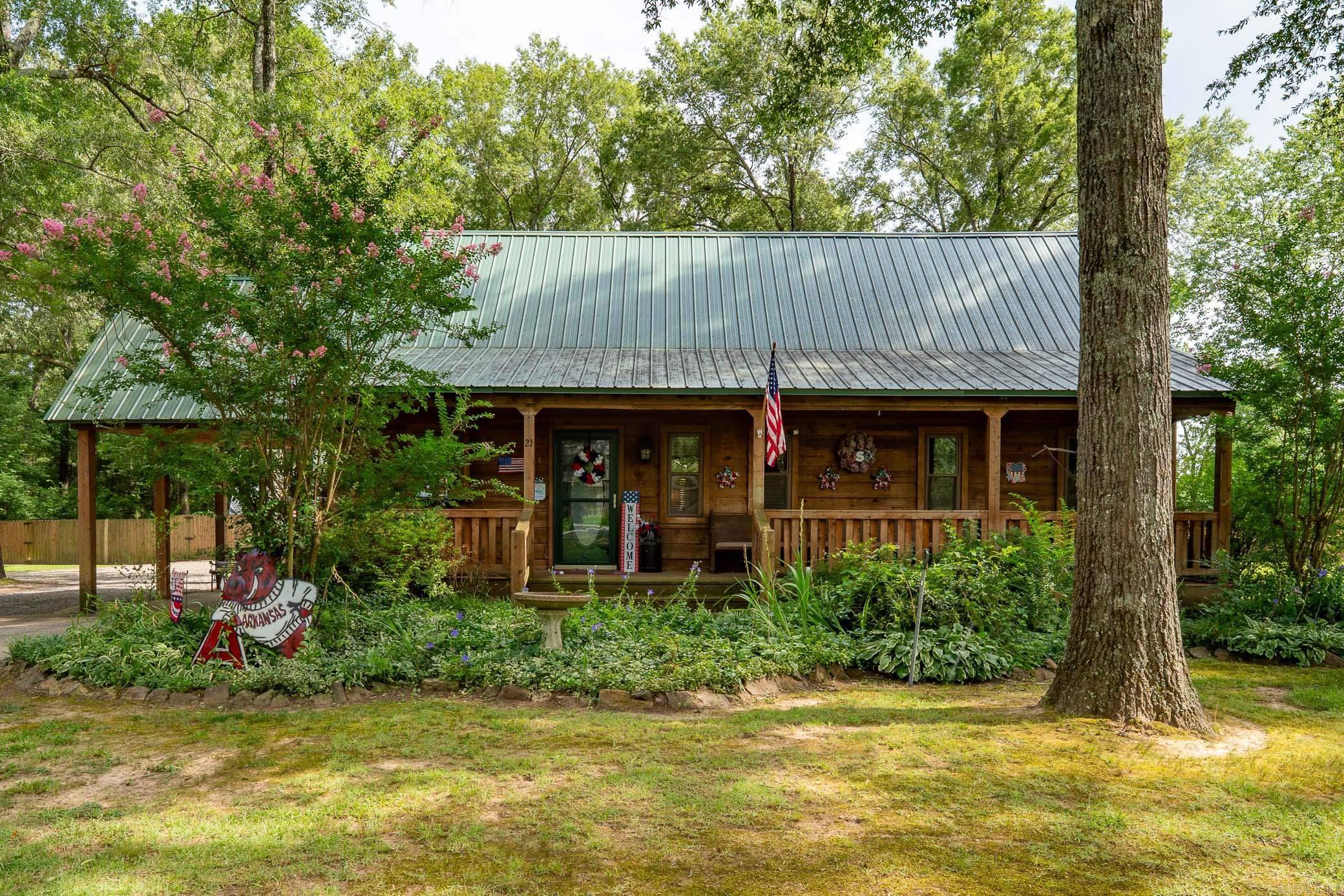 Imagine rocking on the front porch every morning or spending weekends relaxing on the back deck while you grill out. Large 30x50 detached garage/shop. Metal roof. Brand new hvac. Corner lot. Tons of curb appeal. Only thing missing is YOU! Call today to schedule a showing.  Above ground pool can convey or be removed.