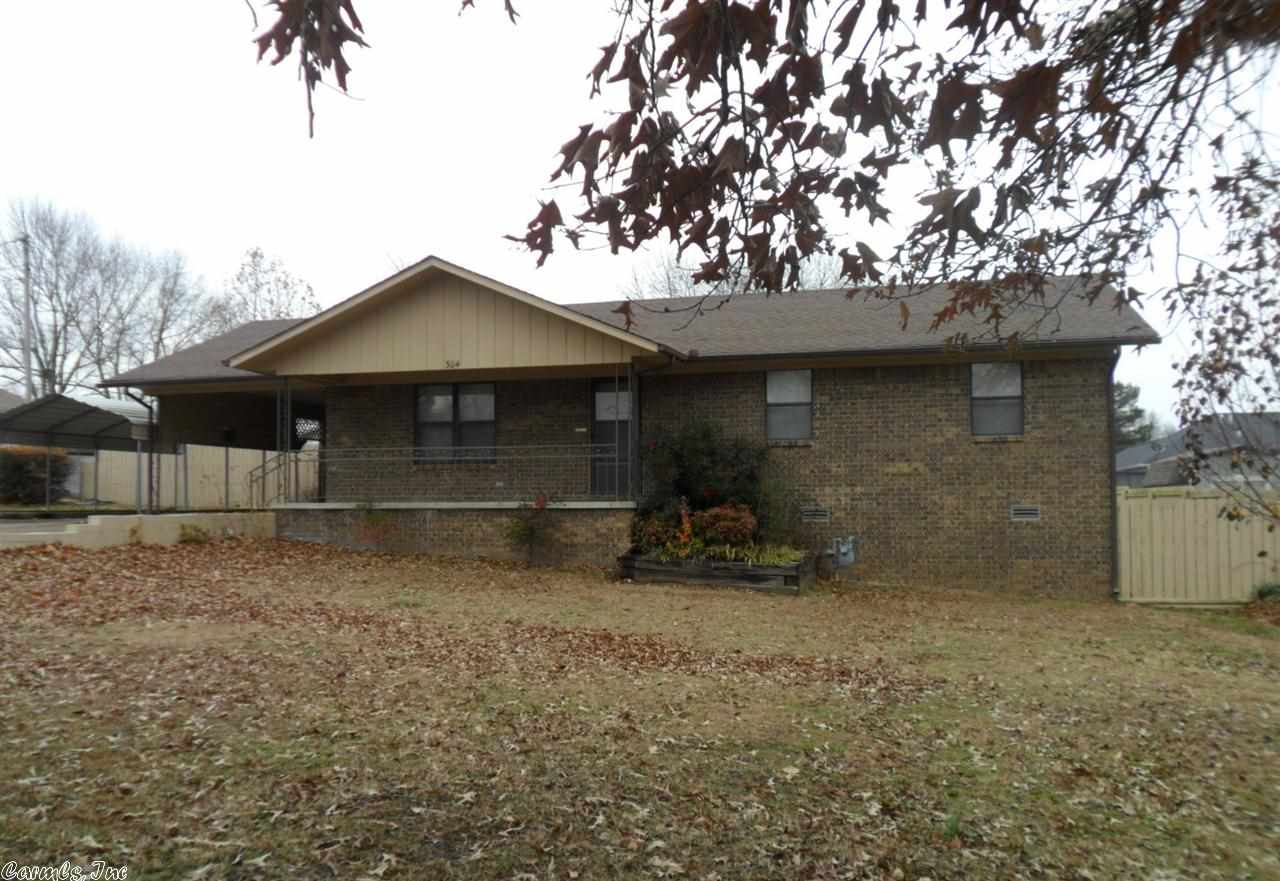 This home and property has a lot to offer with nice level lot, with only gentle slop to street, a fenced back yard for privacy, 2 nice storage buildings, a very pretty view of the mountains.  This a lovely brick home with low maintenance, 3 bedrooms, 2 baths, CH&A, paved drive to spacious carport, and very nice screened in back porch. .  All this at a very affordable price.  A must see to appreciate.