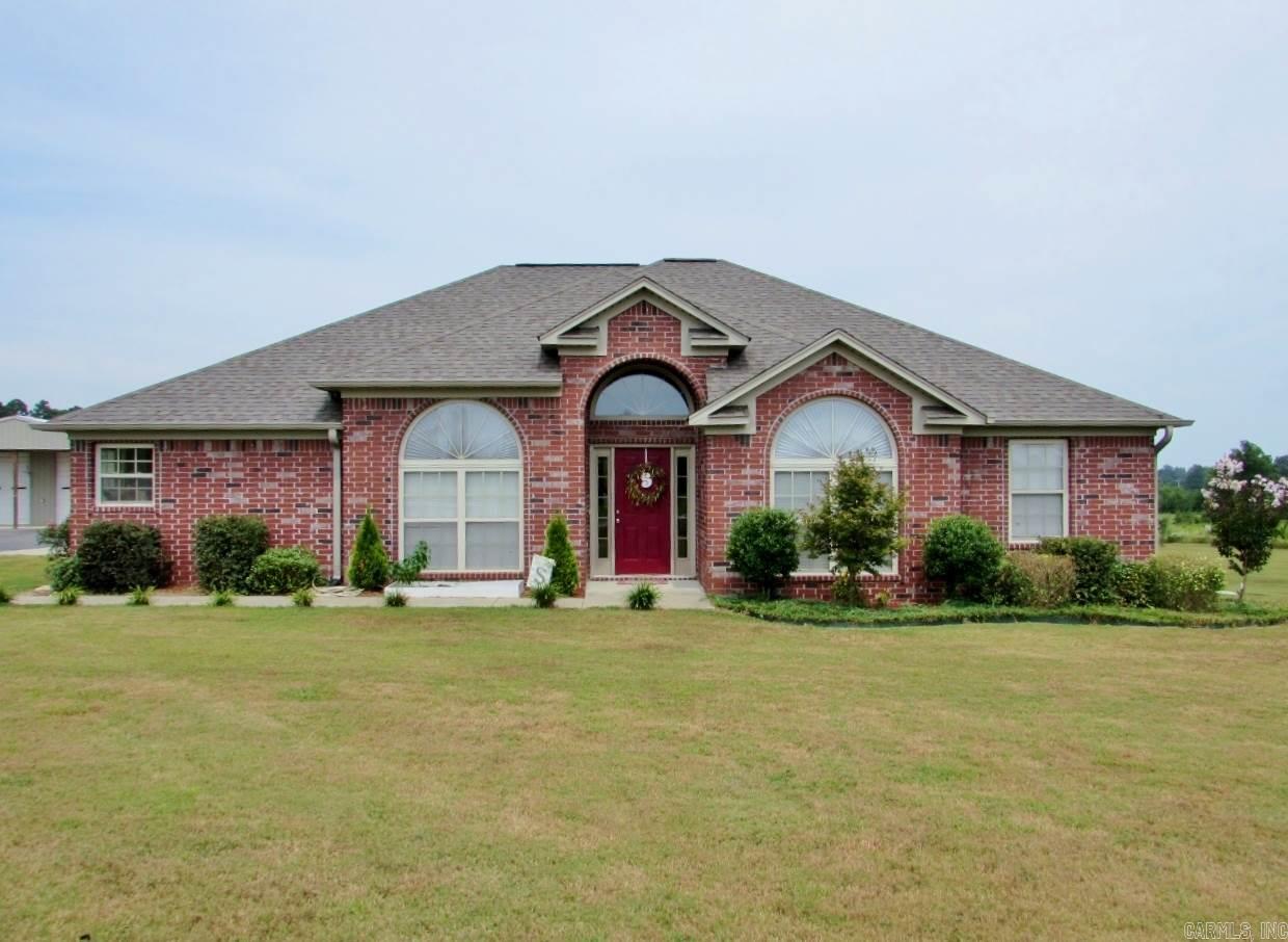 Your first impression will be "wow"!*in the country on 2 acres*only 40 minutes to Little Rock & 20 minutes to Pine Bluff*Sheridan Schools*30x40 insulated shop w/12x40 side shed & 10' front porch, also two 10' overhead doors & one 8' overhead door, also a fish cleaning station*paved driveway to house & shop*home has:seamless gutters*architectural ceilings*fireplace w/gas logs*granite counters*pantry*kitchen appliances stay including refrigerator*bay window*nice tiled shower & separate whirlpool tub*nice home