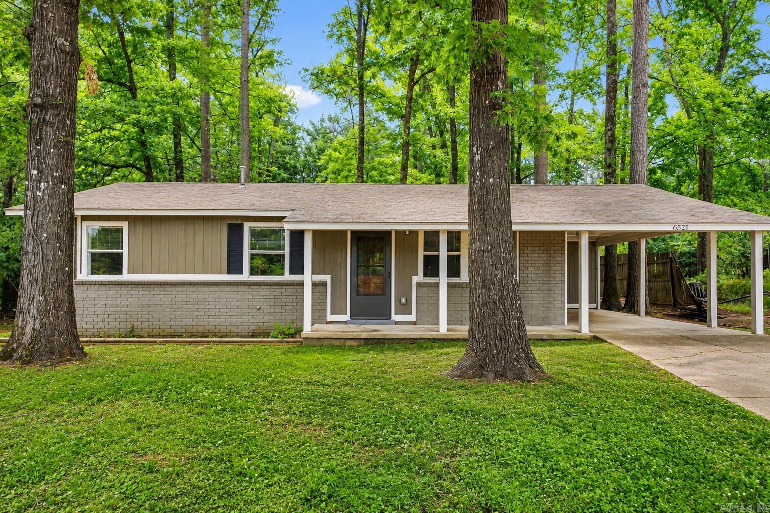 Welcome to 6521 Grayson Drive, a charming 3-bedroom, 1.5-bath home tucked beneath mature trees in the Benton just behind Hurricane Lake. With approximately 1,456 square feet, this home offers a comfortable layout, spacious living areas, new carpet, refreshed interior paint, updated HVAC, electrical system, & water heater. The neutral finishes make it easy to move in and make it your own. The kitchen features plenty of cabinet and counter space, appliances that convey, and room for everyday gathering. Each bedroom offers flexibility and plenty of room to create a space that fits your needs.. Outside, the wooded setting, large trees, attached carport, and generous yard create a private, relaxed feel that is hard to find at this price point. Conveniently located near in the Salem Community near Bryant, Benton, and Alexander, with easy access to shopping, great schools, and major roadways. Whether you’re a first-time buyer, investor, or simply looking for a home with character, space, and potential, this one deserves a closer look.