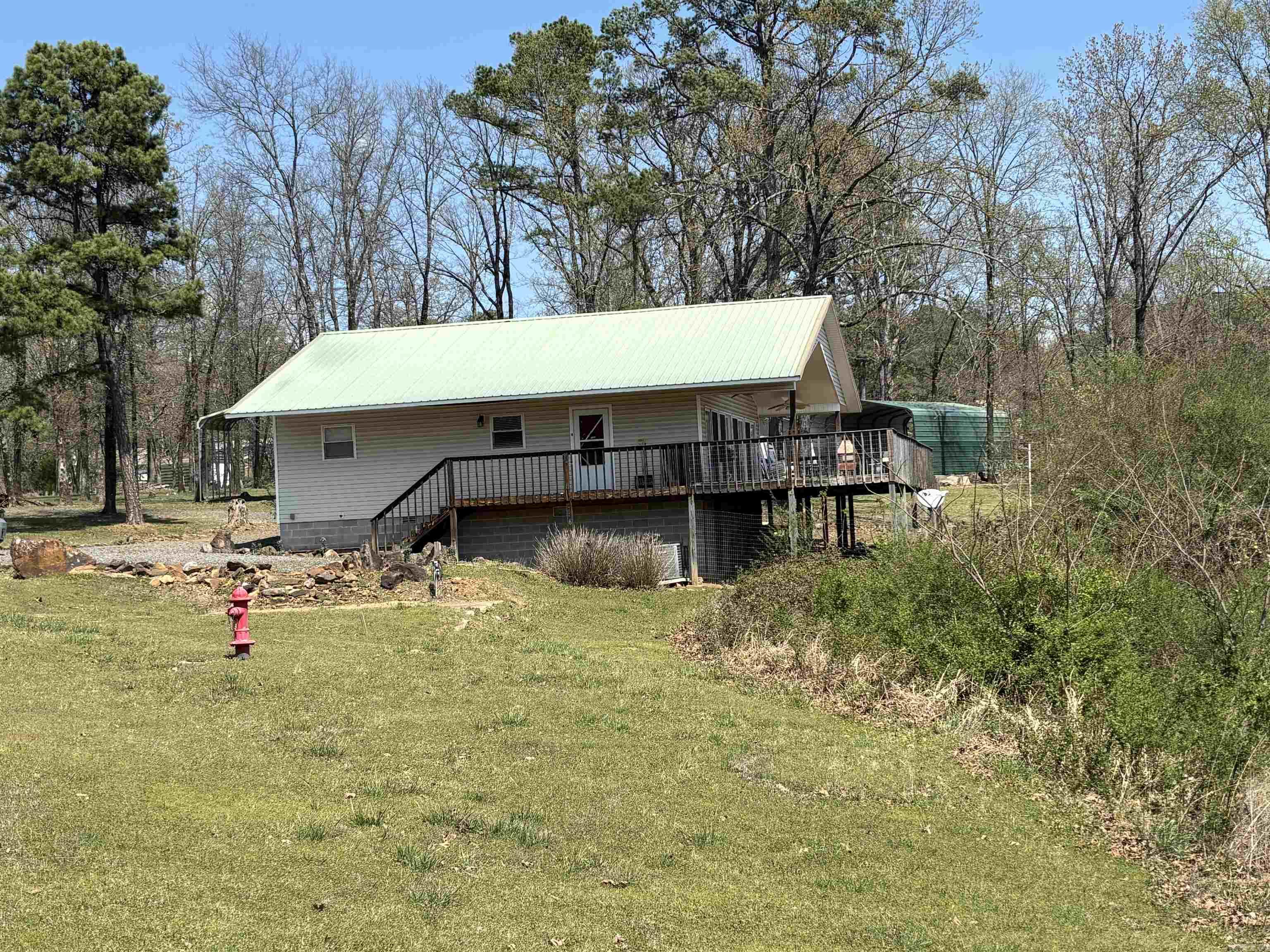 Adorable 2 bdrm, 2full bath home with an amazing view of Greers Ferry Lake! Bring you clothes & groceries you'll have everything you need!  This home comes fully furnished! Huge deck entered from front or back of home!  Great room features full wall of windows and sliding doors exiting out to deck over looking the lake! Has nice outside storage building and carport! You'll have plenty of space & privacy on the approx 1.20 acre!  Just a few minutes to Fairfield Bay!  Give us a call!