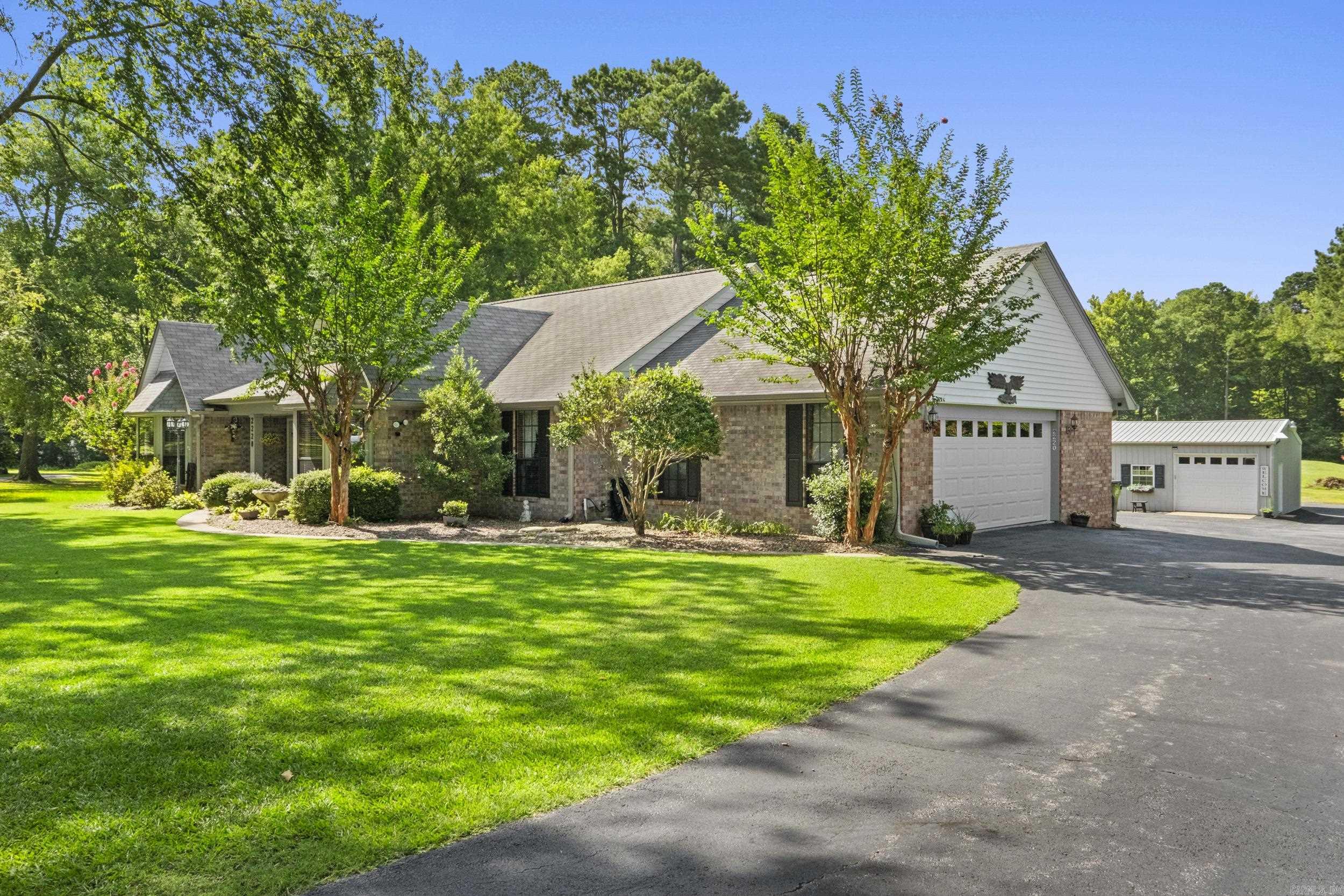 Wow! This Beautifully landscaped home has 3 bedrooms 2 baths, formal dining, eat in kitchen, new kitchen appliances, enclosed sunroom part of sq footage, plenty of storage space. Sitting on 2.94 acres with a 1 acre pond, right in the back yard. There is a 2 Stall RV parking, a large shop and it’s heated and cooled, 1 additional storage building will stay. A whole house generator and an emergency back up generator. Garage has plenty of additional storage with a work bench.There is a pantry off the kitchen area and a large storage in the garage that can be used for additional pantry space.There is also a built in floor safe. This peaceful neighborhood has plenty of trees for that quiet setting. Don't miss out on this wonderful property call today for a private tour. 501.516.5693