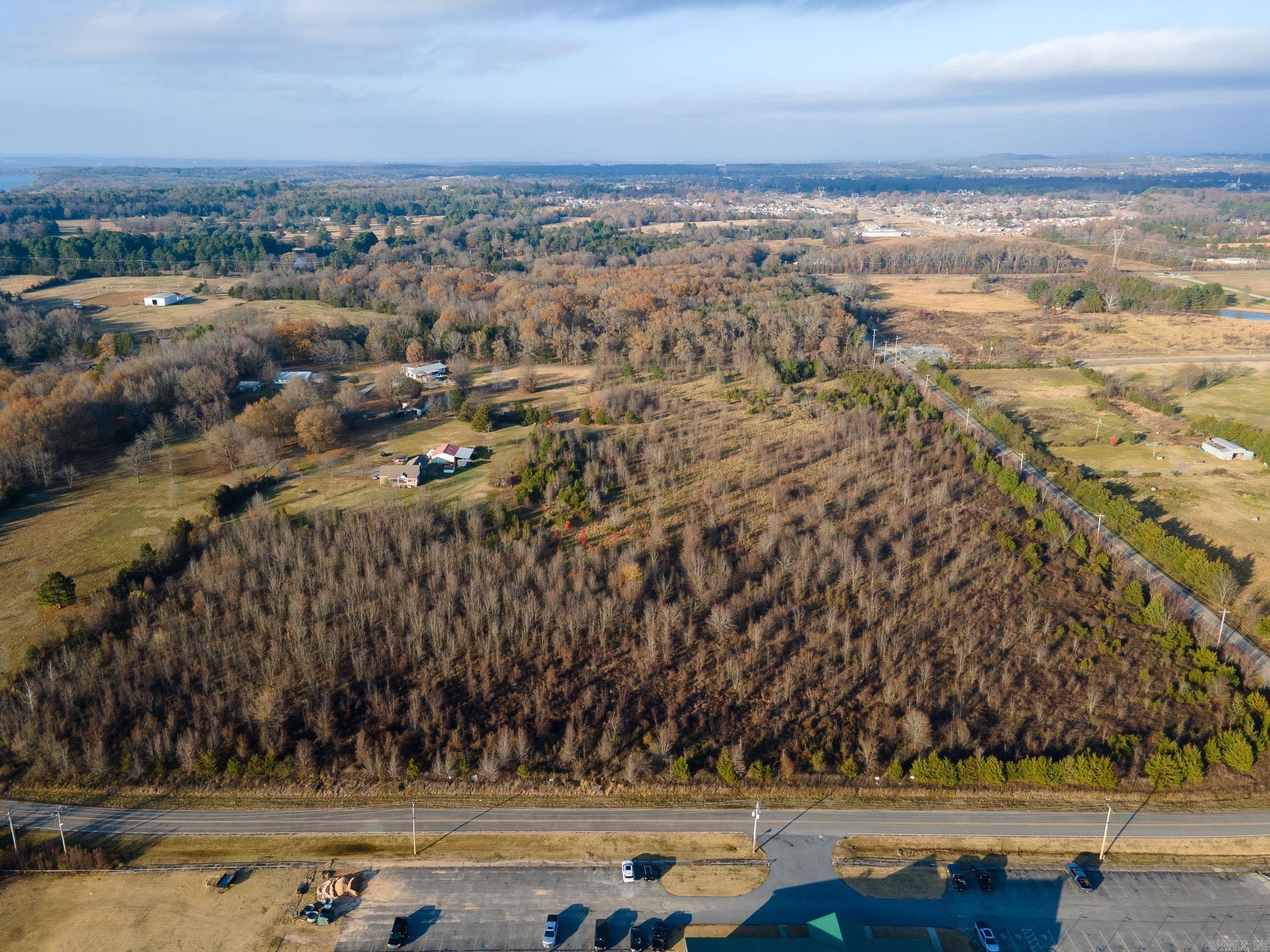 THI IS LAND ONLY ZONED 0-1 WITH ADDITIONAL USE FOR RESTURANT THIS PROPERTY IS ON THE CORNER OF ARTIST LANE AND JOHNNEY  ALLISON ROAD CONWAY CORPORATION UTILITIES ARE AVAILABLE, WATER , GARBAGE PICK-UP AND ELECTRICITY.   1,642 FEET OF PUBLIC  PAVED ROAD FRONTAGE. SEE AGENT REMARKS