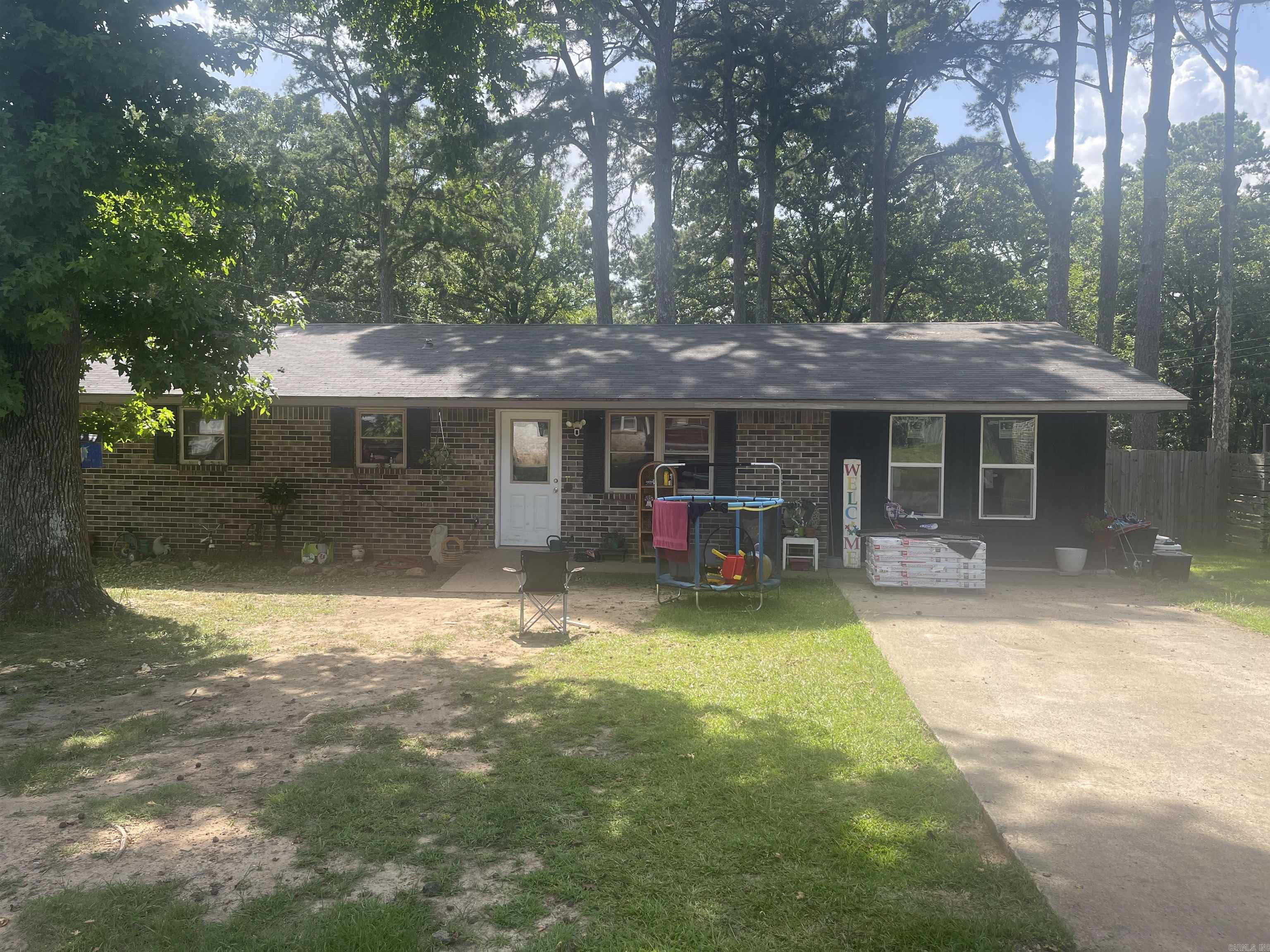 Single-story brick home located on a quiet cul-de-sac in town. This 2-bedroom, 2-bath home offers a functional layout with a bright kitchen featuring a breakfast bar, dishwasher, and adjoining eat-in dining area. The spacious recent addition provides flexible living space and could easily serve as a third bedroom, game room, den, home office, or hobby room. Additional features include an inside laundry area, a fenced backyard on a 0.32-acre lot, and mature shade trees that provide a pleasant outdoor setting. Conveniently located close to local amenities, this property offers comfort, versatility, and a desirable in-town location.
