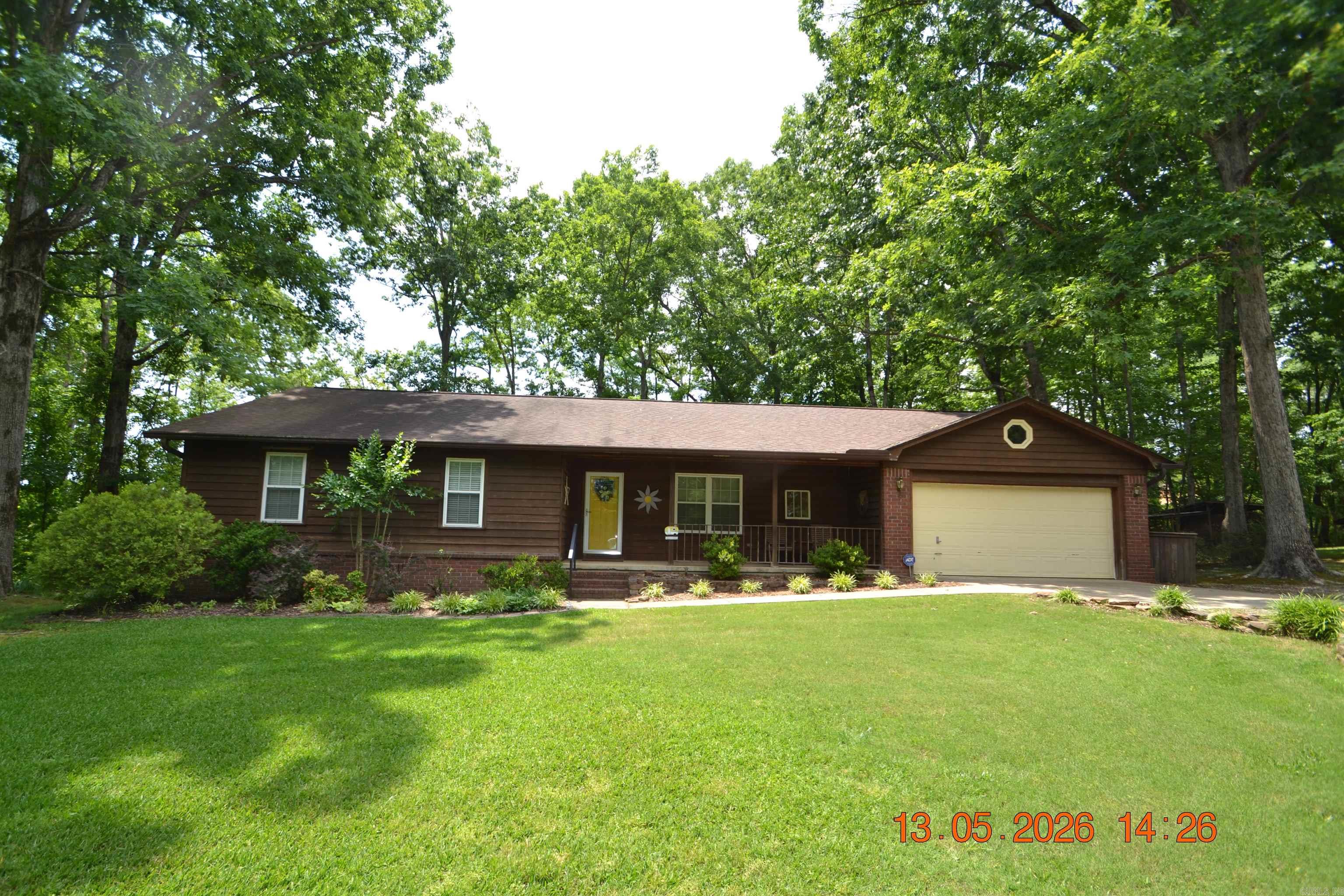Hurry to see this awesome property! If you are looking for a lovely one level home on acreage, with a shop and RV parking....this is IT! This home is move in ready. Great room has wood burning stove with beautiful rock surround & wood mantel. Double French doors open to the 10'x15' sunroom you won't want to leave! Lots of cabinets in kitchen w/breakfast nook. Refrig conveys. Baths have been updated. Extra insulation was added. The deck overlooks the private wooded back yard. The 30'x36' shop has a wood burning stove and 21'x36' of storage space above the shop. The RV cover can accommodate very large RV's. 5000 W solar array on the shop has a battery backup. New inverter and batteries in 2025.  Front yard sprinkler uses well water.  See Agent Remarks.