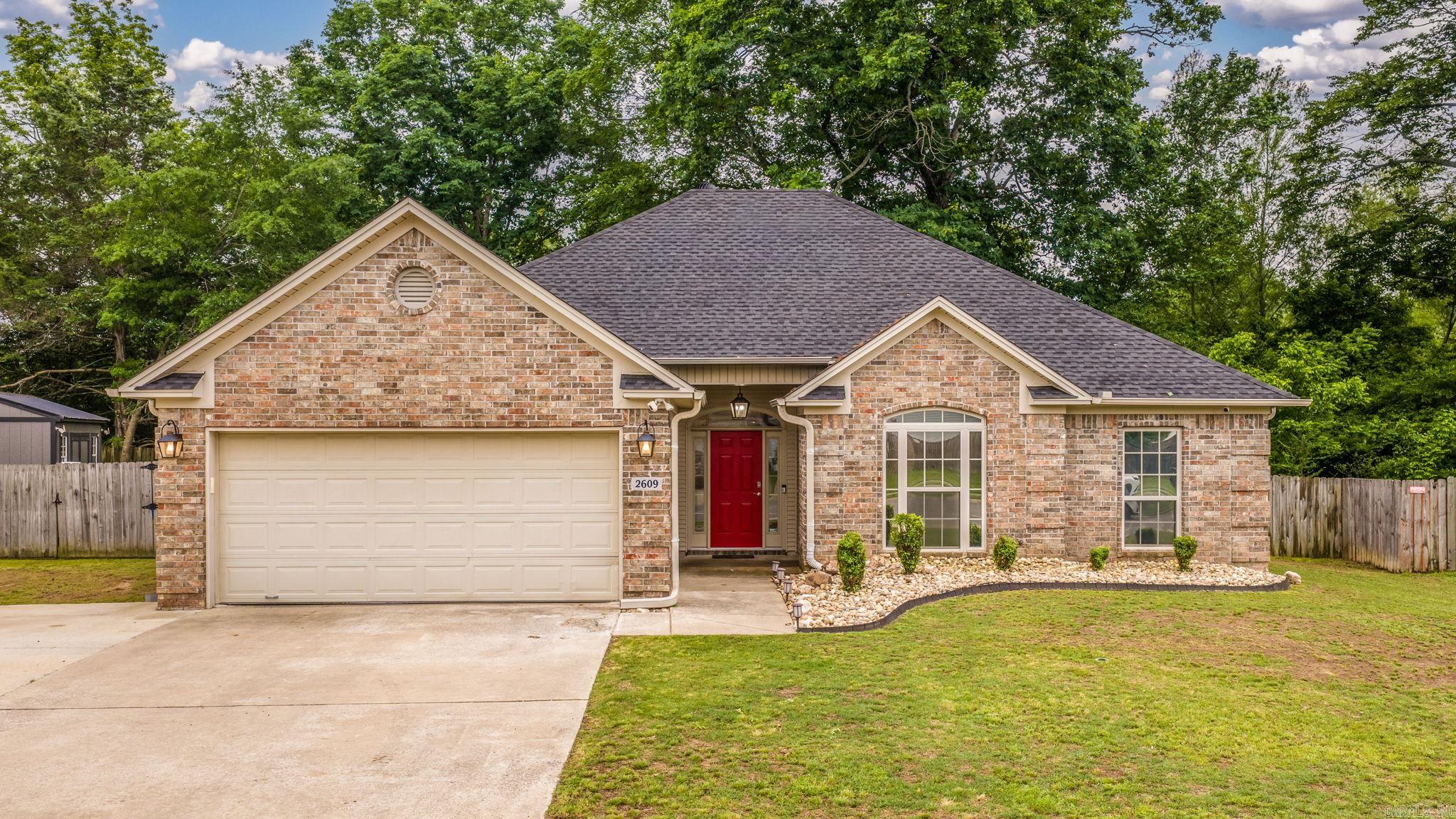 Stunning home w/flexible layout in a highly desirable neighborhood—NEW ROOF! Offering 4 bedrooms or 3 bedrooms plus a large upstairs flex space w/its own full bath,ideal as a game room,theater,guest suite or private living area.Conveniently located just 10 minutes from Bass Pro &minutes from I-30 interstate.Recent updates include a modern “Floating”multi-color electric fireplace,quartz countertops,subway tile backsplash,stainless appliances,updated lighting,fresh paint &new flooring in main living areas,wood beams upstairs,23 recessed lights,an updated laundry room w/added cabinetry &floating shelves,added attic insulation(including insulated pipes)gutters,generator outlet & 30-amp RV plug.Home also offers an extra parking pad &a drive-through gate providing backyard access to the storage /sheshed/man cave.Enjoy the huge private backyard backing to green space,an approx 7’x15.5’ covered porch &a spacious approx 35’x16’ uncovered patio.Move-in ready w/space,style & versatility for today’s lifestyle!