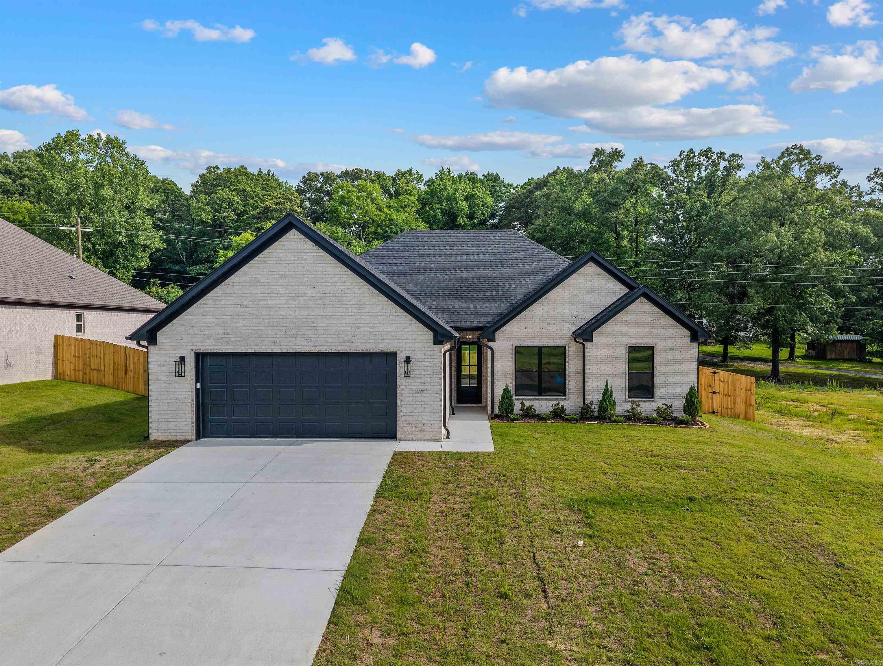 This home is close to schools and downtown Benton. Has LVP flooring, granite countertops, large walk in pantry, island over looking great room. Primary has custom tile shower and free standing tub. has 1/2 bath off of kitchen. Other bedrooms are large with over sized closets. Home comes with privacy fence.        lvp flooring