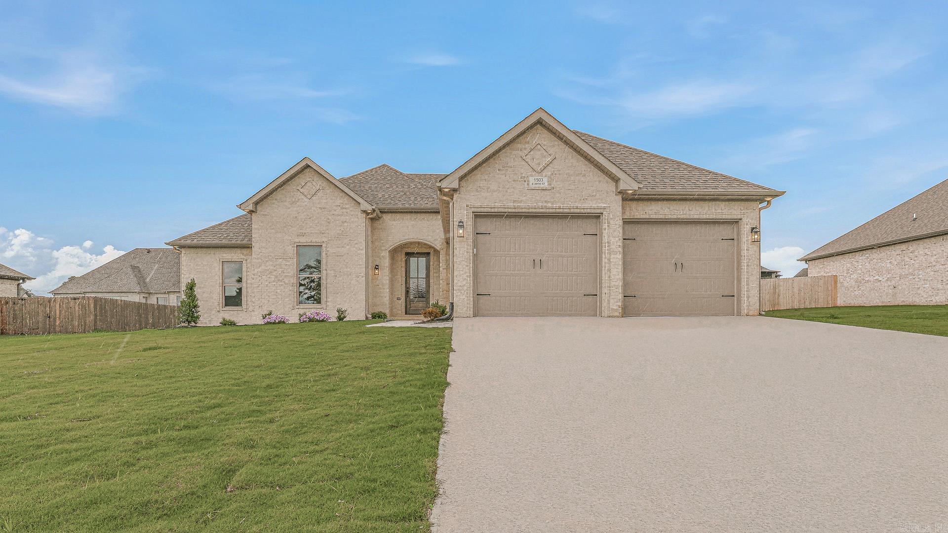 Fresh new construction in Silo Ridge Estates offering style, space, and thoughtful design throughout! This beautiful white brick home features 4 bedrooms and 2.5 baths with a well designed split bedroom arrangement that creates both privacy and functionality. Step inside to soaring ceilings and an impressive foyer w/8 ft entry door in the main living area that opens to a spacious floor plan designed for everyday living and entertaining. The stunning island kitchen is a showstopper with quartz countertops, brass accents, pendant lighting, stainless appliances, pantry, breakfast bar seating, and abundant workspace. Enjoy gathering in the dining area and inviting great room anchored by a cozy fireplace. The private primary suite offers a relaxing retreat with a convenient walk through closet leading directly into the laundry room. Complete with a double garage and covered patio for outdoor enjoyment, this newly built home combines modern finishes with comfortable living in one beautiful package.