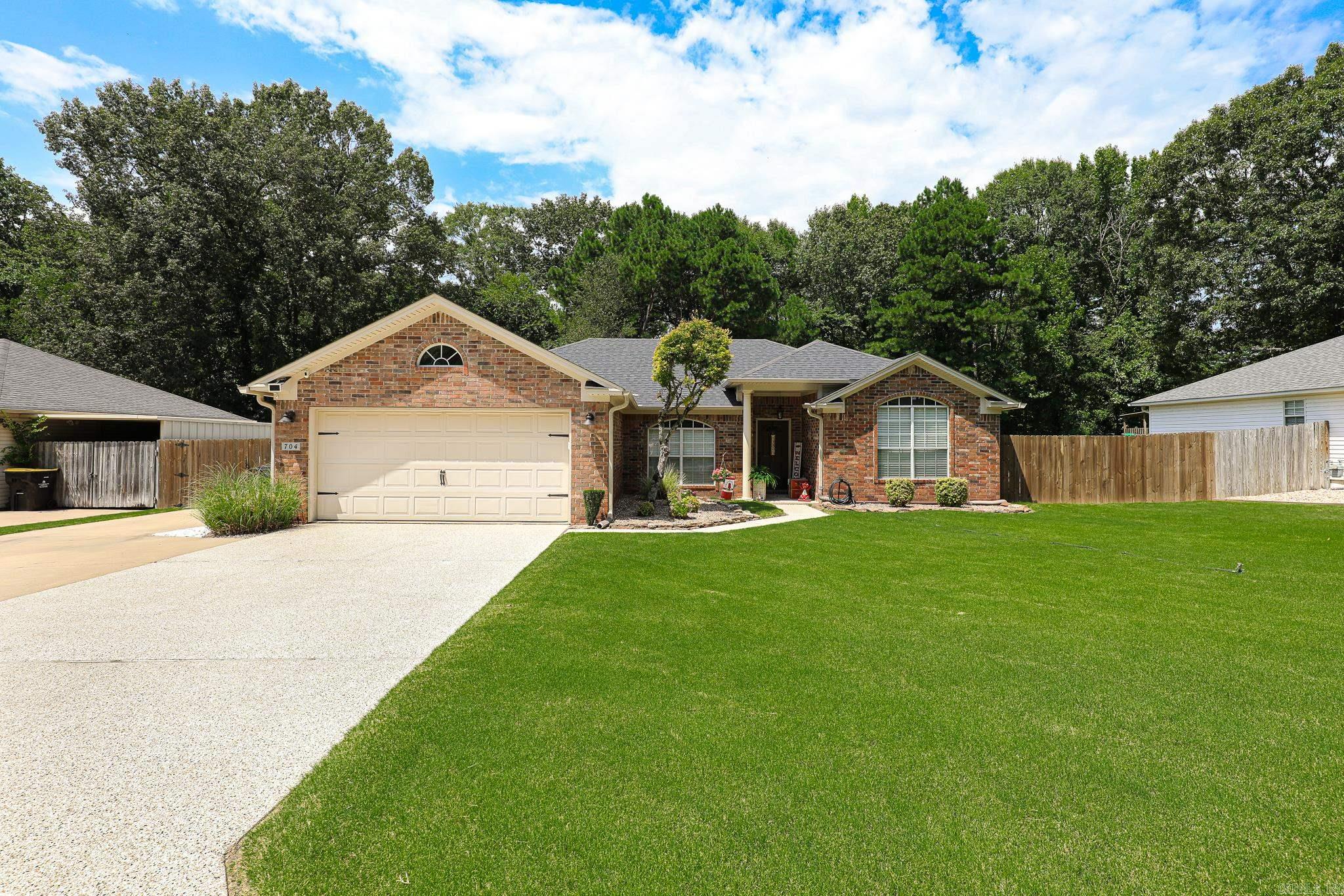 OH MY! What a backyard Oasis! Perfect for relaxing OR for family gatherings.  Gorgeous GUNITE Saltwater 18x36 POOL 2023! New salt cell. Covered Hot Tub 3 yrs old. Covered back patio. 12x24 SHOP! New HVAC-2024, Wtrhtr 2018. Roof 2023. Updated lighting & faucets. Privacy fence-2020. Extra driveway space. Dbl gate to 10x24 Covered concrete pad for boat or auto. Driveway & sidewalk has new coating. Home features a split floor plan. Large primary bedroom & bath. Jetted Tub & separate shower. Formal Dining and Breakfast room. Granite counters in kitchen. Stainless appliances. Home has decorative wall features. Updated Flooring. Separate laundry room. Home is wired for a generator.   This Home is very well kept and is a must see! The backyard and pool are fabulous! See agent remarks.