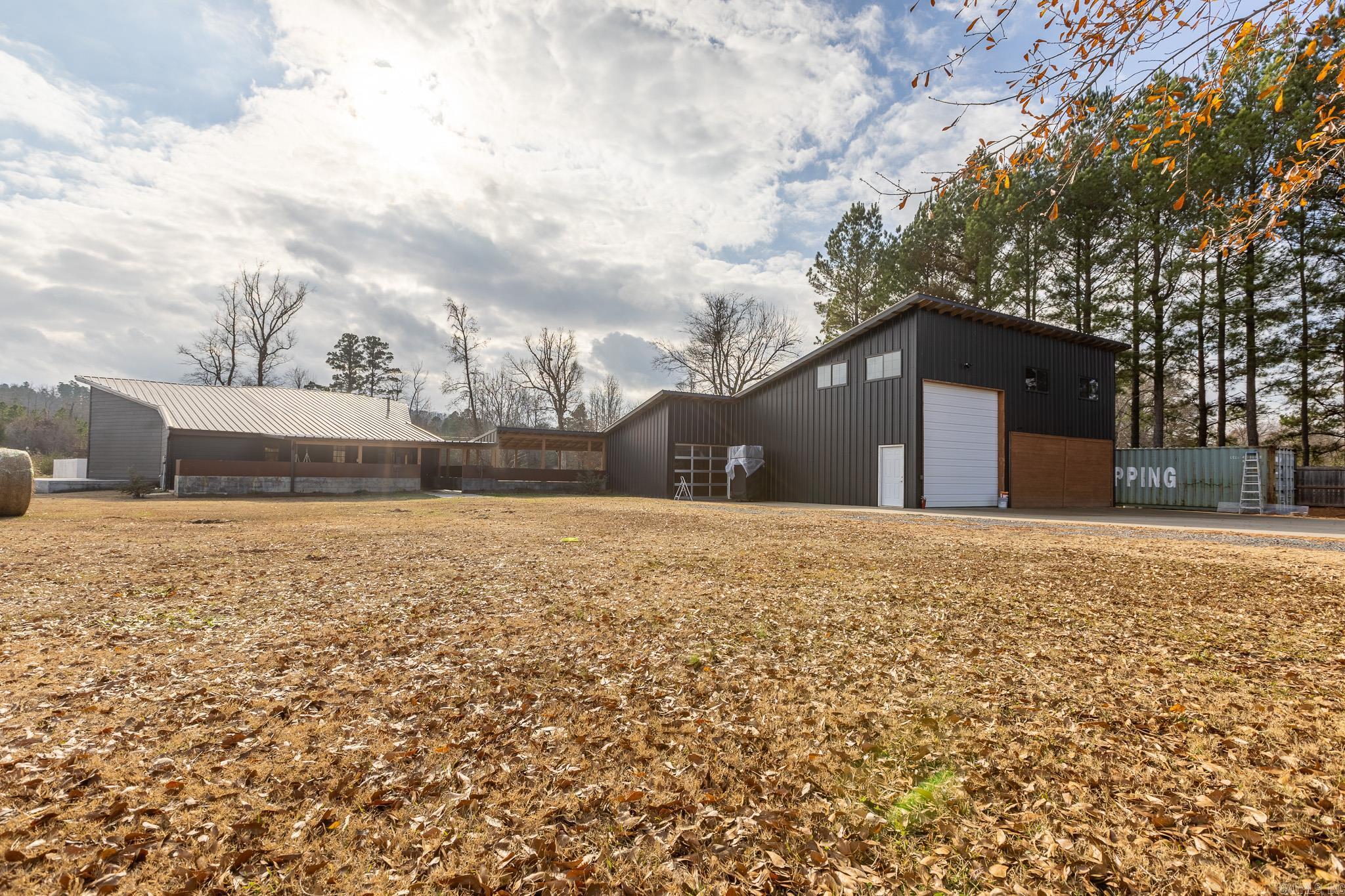 Discover a stunning ranch-style retreat just minutes from West Little Rock. This private estate features a beautifully designed home with vaulted ceilings, natural wood accents, and huge windows framing incredible mountain views. Enjoy a fully equipped shop with an office loft, a custom barn, and a resort-style pool with an oversized entertaining deck—perfect for relaxing or hosting.  The property also includes a spring-fed pond, a year-round creek, mature trees, and serene outdoor spaces full of wildlife. With easy access to the Promenade at Chenal, Pinnacle Mountain State Park, restaurants, and top-rated schools, this is a rare opportunity to enjoy both privacy and convenience.  A one-of-a-kind Arkansas oasis ready for its next owner.