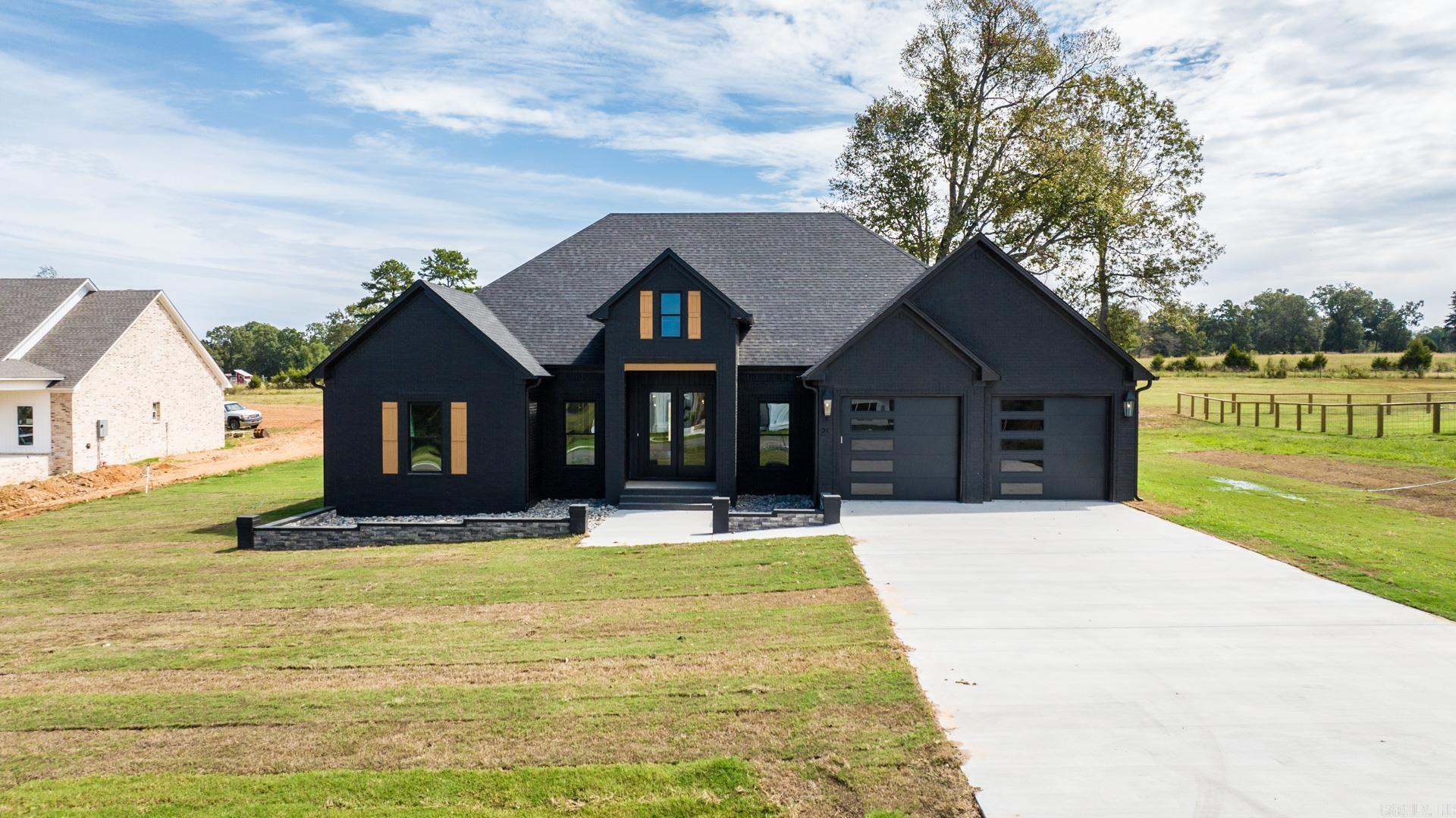 HIGH SPEED FIBER here! This house is a showstopper! Garage doors, primary bath shower glass and bathroom mirrors will be completed within the next 2 weeks. This one is ready for you to make your home. Kitchen has so much storage not counting the huge pantry hidden behind the cabinets in the kitchen. Enjoy the ambiance of the electric fireplace in the spacious living room. The guest bedrooms are separate from the primary bedroom. There is extra storage in the guest bath perfect for linens. You will be impressed with the laundry room and all the cabinetry as well as the size of the primary closet. The laundry room joins the primary closet and the closet enters the primary bathroom. The shower in the primary bath is beautiful. Private water closet. Enjoy the large backyard view from the covered patio. You will want to be a part of this beautiful new neighborhood.