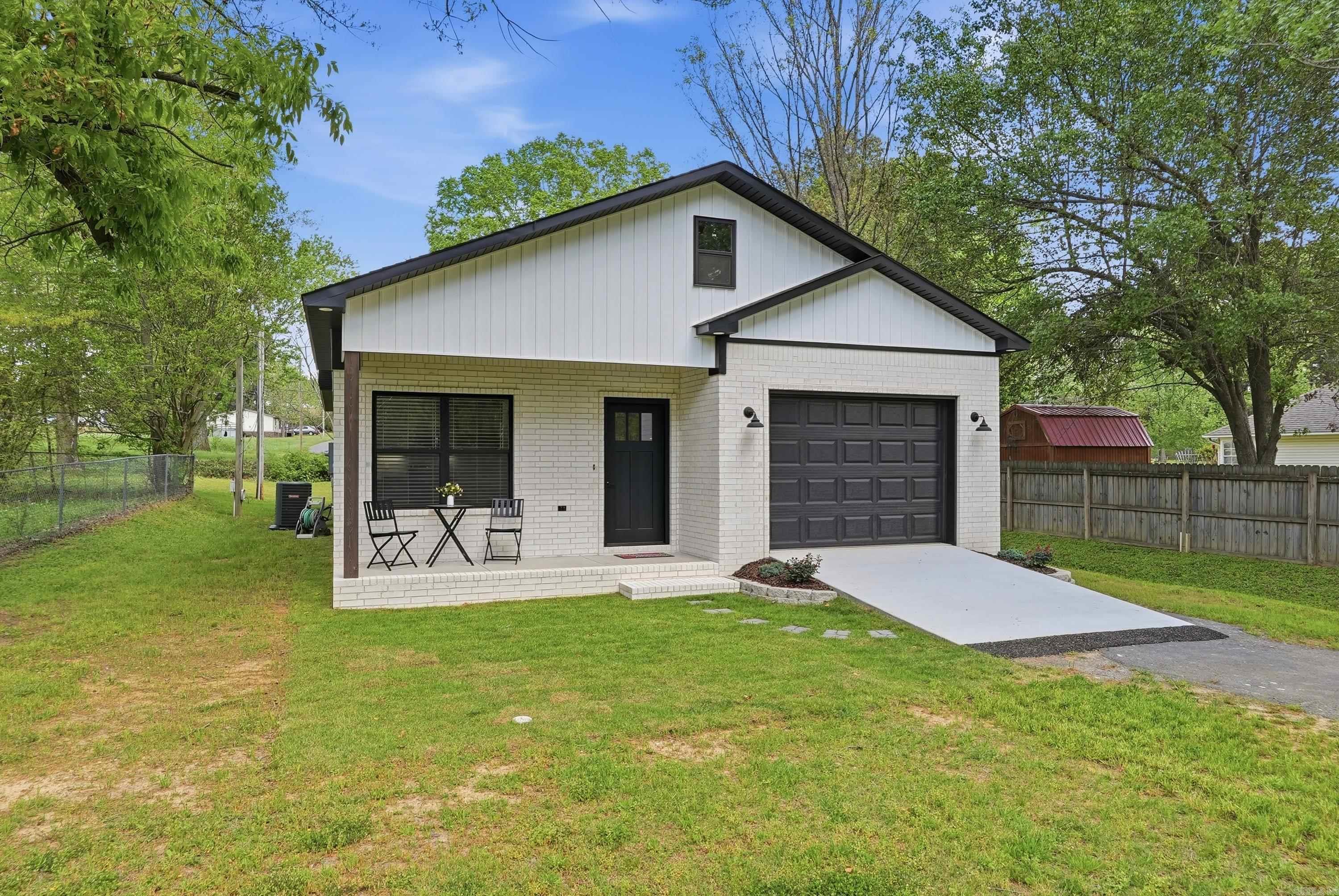 Welcome to 6 7th Street in Greenbrier, Arkansas, a rare opportunity to own the least expensive new construction home currently on the market in Greenbrier AR. Home buyers searching for affordable new homes in Greenbrier AR will appreciate the modern design, efficient layout, and convenient location within an established neighborhood. This immaculate 3 bedroom, 2 bathroom home offers a thoughtfully designed open floor plan that maximizes both comfort & functionality. Each bedroom features generous walk-in closets, providing ample storage, while the kitchen includes a full walk-in pantry and abundant cabinet space, making organization simple & practical. Every square foot of this home has been carefully planned for easy everyday living. Enjoy the charm of small-town living located just minutes to top rated Greenbrier schools, park, shopping, and dining. All public utilities are connected, ensuring true move-in readiness, and the new wood privacy fence in the backyard enhances outdoor enjoyment. This home stands out as an incredible value for buyers seeking quality new construction at an affordable price. Schedule your private showing today and see why this home stands out.