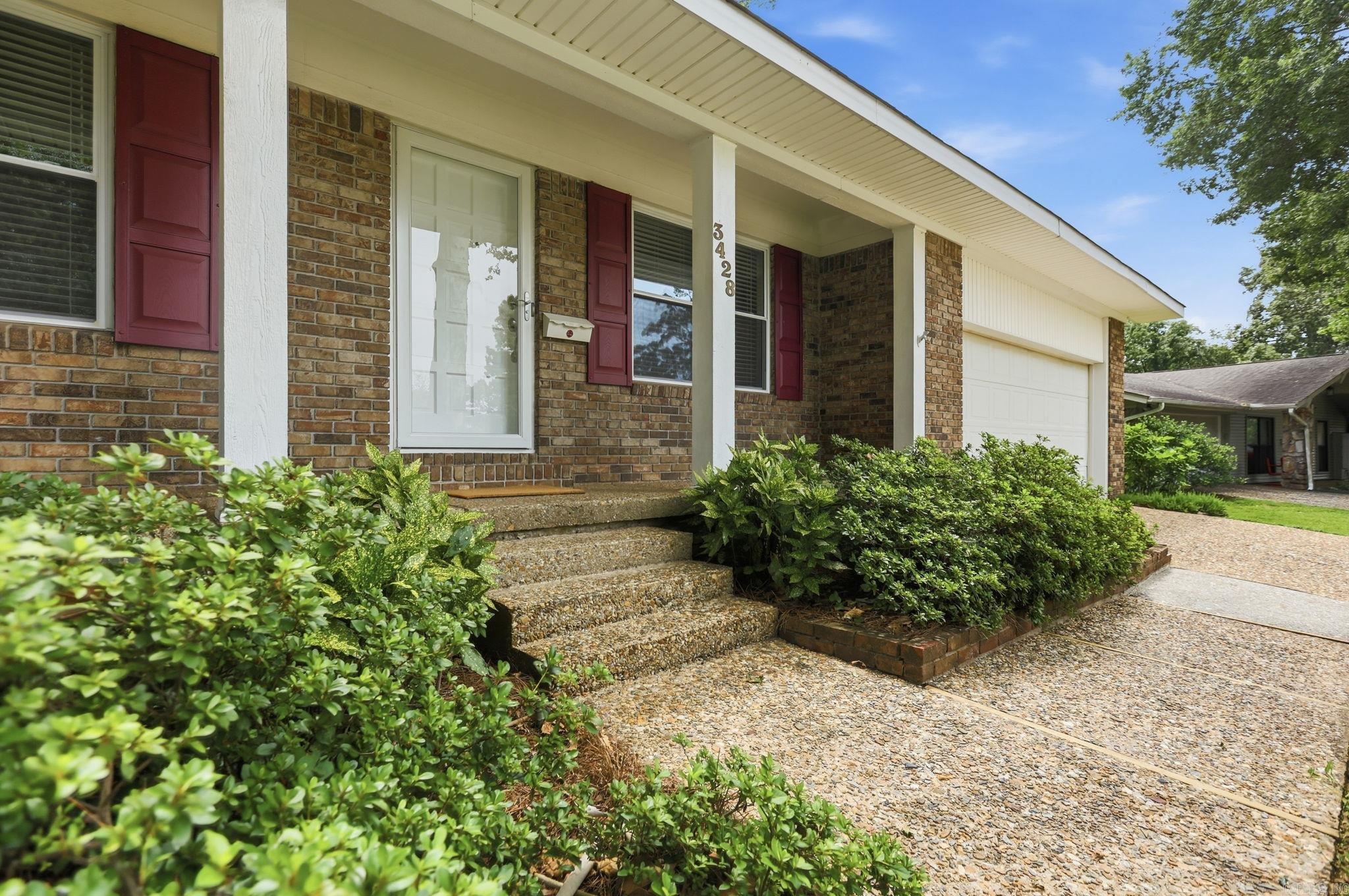 In the heart of North Little Rock’s beloved Lakewood area, where warmth, charm and everyday comfort come together beautifully, this extremely well-maintained home offers 3 bedrooms, 2 beautifully updated bathrooms, two large comfortable living spaces filled with natural light streaming through newer windows, and a lovely updated kitchen designed for both everyday living and easy entertaining. A standout feature—especially rare for many Lakewood homes—is the full interior laundry room with sink, adding function and ease to daily living. Outside, the lush backyard is a true gardener’s delight, featuring fruit trees, a fully fenced vegetable and herb garden, storage shed and plenty of room to enjoy outdoor living and quiet mornings surrounded by greenery. The expansive, tiled patio area is complete with a built-in grill. Ideally located within walking distance of the area’s middle school, this inviting Lakewood home offers the warmth, updates and lifestyle buyers are looking for in one of North Little Rock’s most established communities.