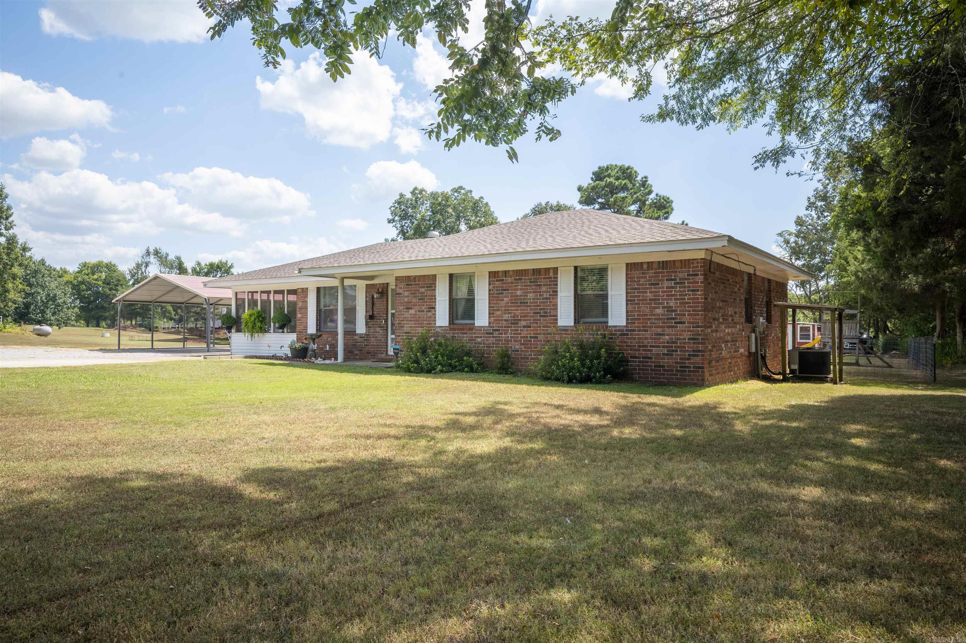 This 3 bedroom, 2 bath brick home sits on a spacious lot with a fenced backyard ideal for kids, pets, and outdoor gatherings. A screened-in porch offers the perfect spot to relax year-round, while the above-ground pool (included) will be ready for summer fun when warm weather returns.  Inside, the home features a comfortable layout with a cozy gas log fireplace as a centerpiece. A thoughtful addition expanded the living room, bathroom, and laundry area—providing extra square footage and functionality for everyday living.  Whether you're looking for space to entertain, enjoy quiet evenings by the fire, or simply a move-in ready home with great amenities, this property has it all.