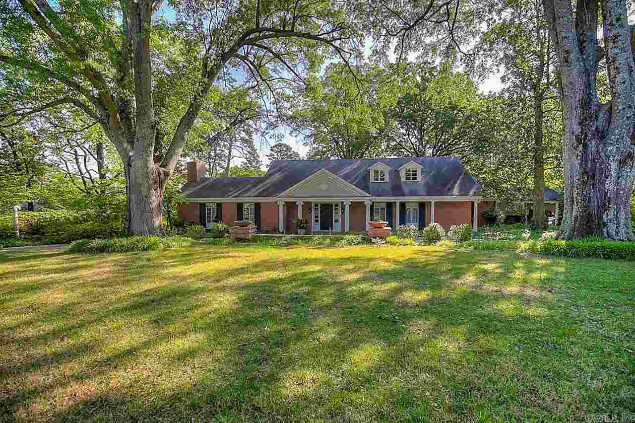 Stately home on 1.16 acre property.  Circular drive, beautiful street, desirable neighborhood.  3 living areas - all rooms are exceptionally large & open.  Floor to ceiling windows afford views to landscaped yard, pool area, distant valley & hills. 9' ceilings , hardwoods throughout. 335 sf guest house (heated and cooled, not included in main house measurements).  2 car carport w/workshop - storage.  Beautiful 18' x 36' pool.  A very special property.