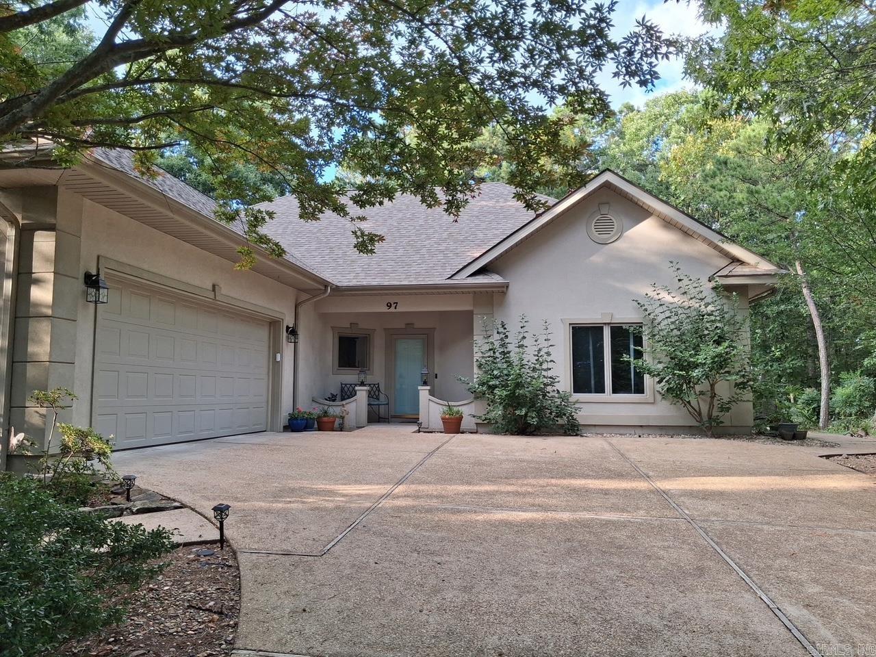 This Beautiful custom-built home is thoughtfully designed and perfectly situated on a gentle lot offering exceptional privacy in a peaceful, nature-filled setting. Professionally landscaped gardens & low-maintenance patio offers multi spots to relax & enjoy outdoor living. Contemporary architecture with a high-pitched roof and attractive synthetic stucco exterior offers lasting curb appeal and minimal maintenance. Major updates include a new roof (2022) and HVAC system w/air purifier (2025). Inside, the bright & airy living room filled w/natural light & features tall ceiling, abundant natural light, rounded-corner walls, wood-grain laminate flooring & a cozy gas-log fireplace. Bright & inviting kitchen w/LED recessed lighting, solid-surface capped countertops, center island, NEW built-in wall oven & microwave, new attractive backsplash, coffee station, and wine rack. Primary suite offers a well appointed bath w/a step-in shower, jetted tub, separate vanities & walk-in closets. Add'l highlights include a split-bedroom floor plan, 36-inch doorways for enhanced accessibility and a convenient location near golf, lakes, trails, shopping, restaurants & other amenities. Agent remarks.