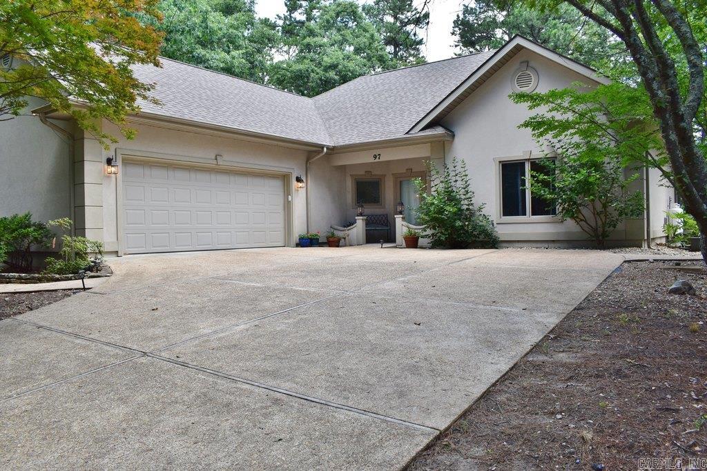 This Beautiful custom-built home is thoughtfully designed and perfectly situated on a gentle lot offering exceptional privacy in a peaceful, nature-filled setting. Professionally landscaped gardens & low-maintenance patio offers multi spots to relax & enjoy outdoor living. Contemporary architecture with a high-pitched roof and attractive synthetic stucco exterior offers lasting curb appeal and minimal maintenance. Major updates include a new roof (2022) and HVAC system w/air purifier (2025). Inside, the bright & airy living room filled w/natural light & features tall ceiling, abundant natural light, rounded-corner walls, wood-grain laminate flooring & a cozy gas-log fireplace. Bright & inviting kitchen w/LED recessed lighting, solid-surface capped countertops, center island, built-in wall oven & microwave, new attractive backsplash, coffee station, and wine rack. Primary suite offers a well appointed bath w/a step-in shower, jetted tub, separate vanities & walk-in closets. Add'l highlights include a split-bedroom floor plan, 36-inch doorways for enhanced accessibility and a convenient location near golf, lakes, trails, shopping, restaurants & other amenities. See agent remarks.