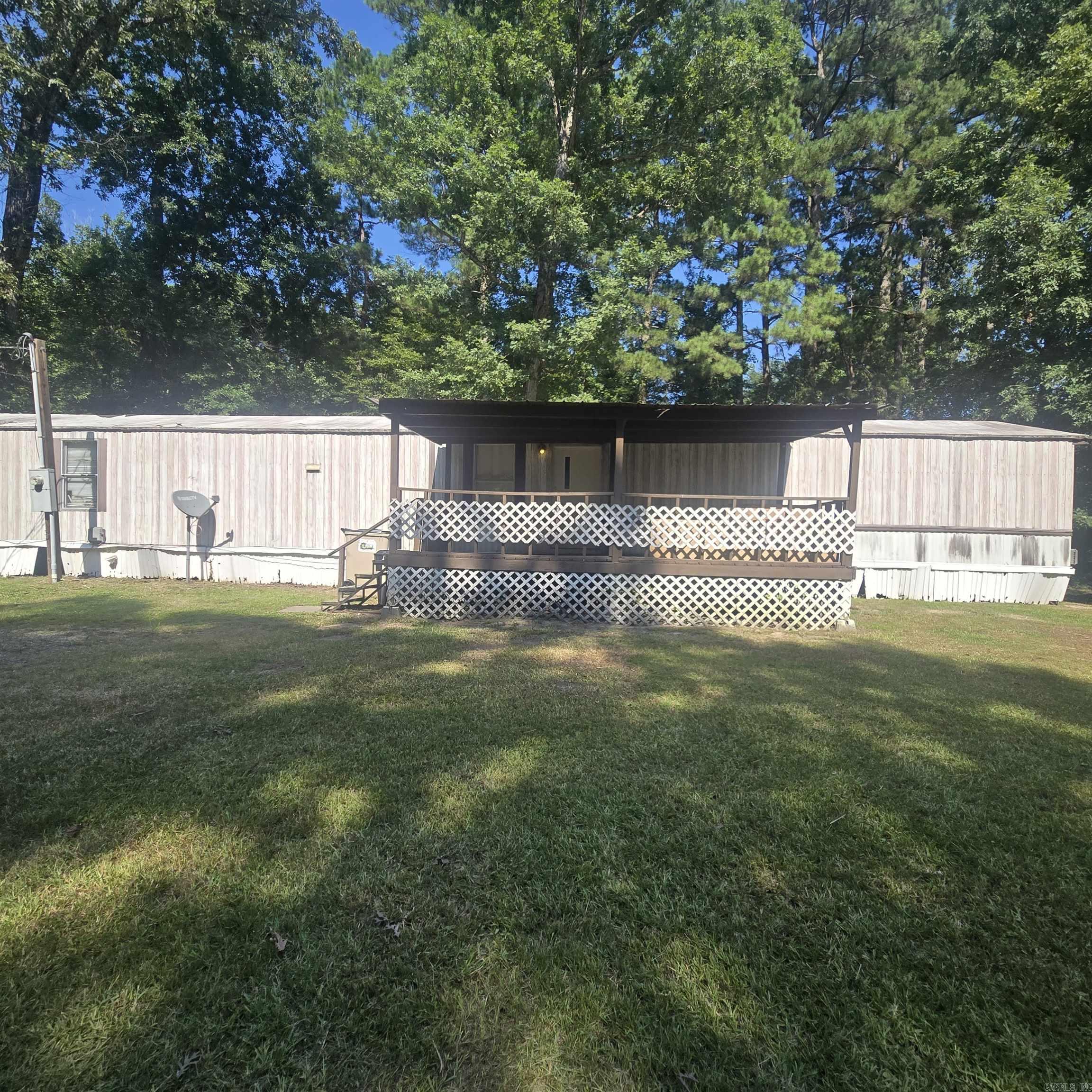 This home offers a great opportunity for investors or buyers ready to roll up their sleeves! Several updates have already been completed, giving you a head start, but there's still plenty of work left to bring this property to its full potential. With a functional layout, generous lot, and room to add your personal touch, this home is full of possibilities! Whether you're searching for an affordable place to call home or your next renovation project, this property is sold "as-is" and is priced accordingly. All utilities are on. Home will not qualify for any VA, FHA or RD loans. Cash or in house conventional loan only. All electric. There is a creek on the property as well!  Community features include Clearwater Lake for fishing and a playground! Only for residents!   Agents, please see remarks.