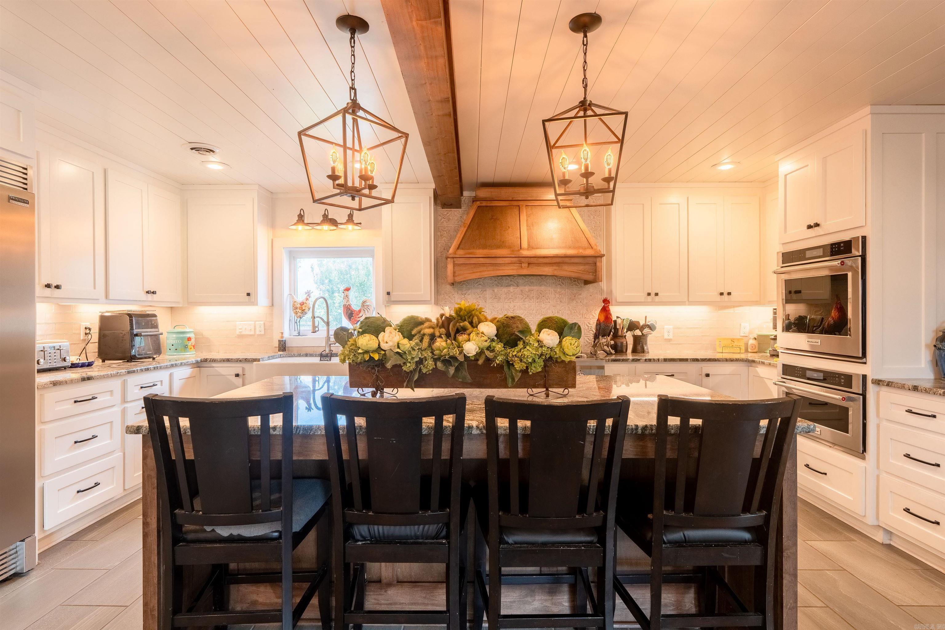 Discover the perfect blend of comfort and spaciousness with this unique property featuring two homes on 14.68 scenic acres. Whether you're seeking a peaceful retreat or a versatile estate, this property has it all. Home (4BR/3BA) approx 3707 sq, ft. Spacious 4-bedroom, 3 full bathrooms, large bonus room, ideal for entertainment with solid hardwood floors throughout. Gourmet kitchen with granite countertops commercial-grade appliances, including two dishwashers and a 6-burner propane stove with griddle Built-in pantry and freezer for ample storage Modern amenities: tankless hot water, spray foam insulation, recent A/C & heating system Relax outdoors on the expansive Trex deck overlooking the property.  Explore 14.68+ acres of lush landscape with a seasonal creek, three ponds, and fenced pasture for livestock workshop and a barn for storage or hobbies Perfect for farming, animals, or simply enjoying nature This property offers the serenity of country living with modern comforts and ample space for all your needs. Don’t miss out!