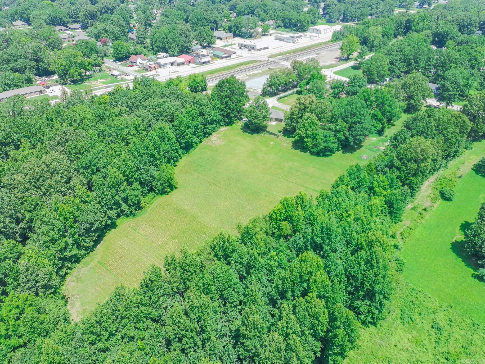 Great opportunity to own 3.5 acres inside the city limits of Brookland. Located at 106 E. Hinkley, this R-1 zoned property offers a beautiful mix of open pasture and mature trees, creating a private, secluded feel while still being just minutes from schools, shopping, and everyday conveniences. The gently cleared homesite provides plenty of room to build your dream home with space for a shop, outdoor living, or simply enjoying the peaceful surroundings. If you've been searching for acreage in town that's both open and private, this property is one you won't want to miss.