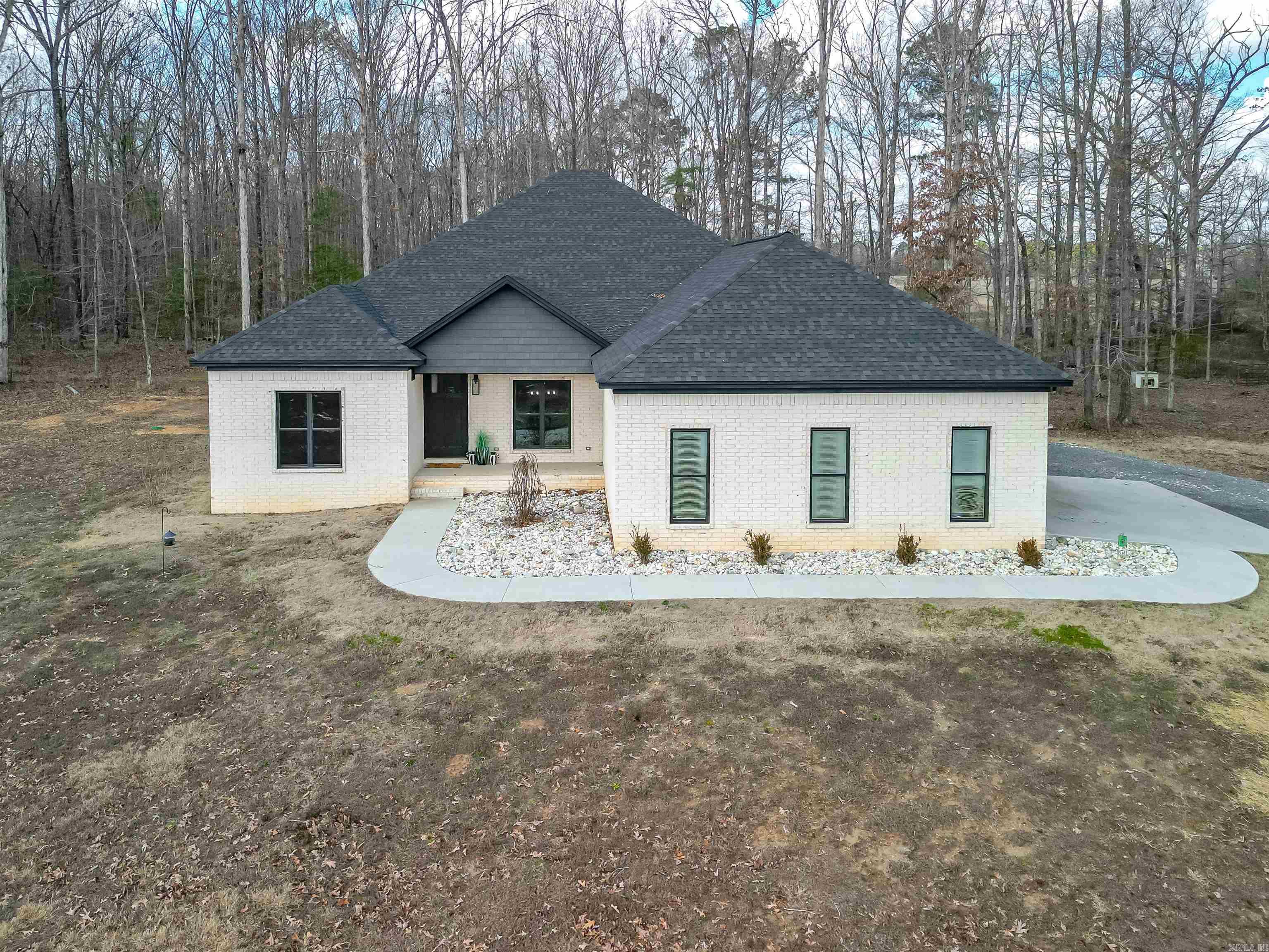 Welcome to this charming country retreat! This cozy 4-bedroom 2 full bath 2 half baths home is minutes from town. Spacious bedrooms. Enjoy the back porch while grilling on the hibachi grill .60x40 shop with a 10x60 lean too, with 1-bedroom, full kitchen apartment. Rent it out or it would be great for extra family. You don't want to miss looking at this amazing house!
