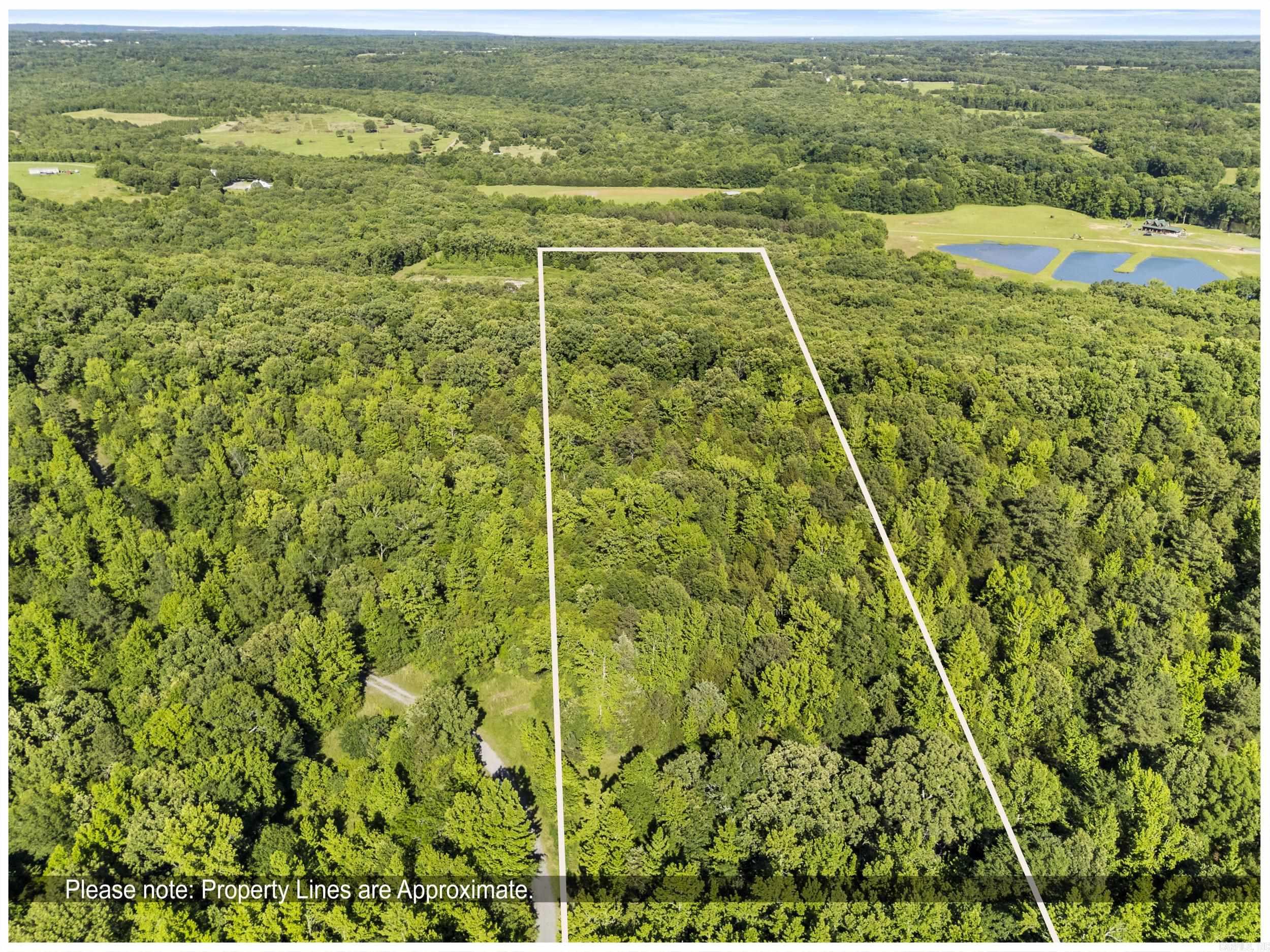 Enjoy peaceful country living just minutes from town on this scenic 3-acre property in Searcy, AR. A two-year-old road leads to the top of the lot, where panoramic forest views and a cleared, build-ready site await—perfect for your dream home or cabin. The land includes a sturdy stick-frame lean-to with awning for storage, gatherings, or outdoor projects. With its mix of level and sloped terrain, this acreage offers both beauty and versatility. Conveniently located just outside the city, you’ll enjoy privacy while still being close to local amenities. Whether you’re searching for a private homesite, recreational getaway, or investment property, this rare piece of Arkansas countryside offers easy access, natural scenery, and room to grow. Don’t miss your chance to make it yours—schedule your showing today!