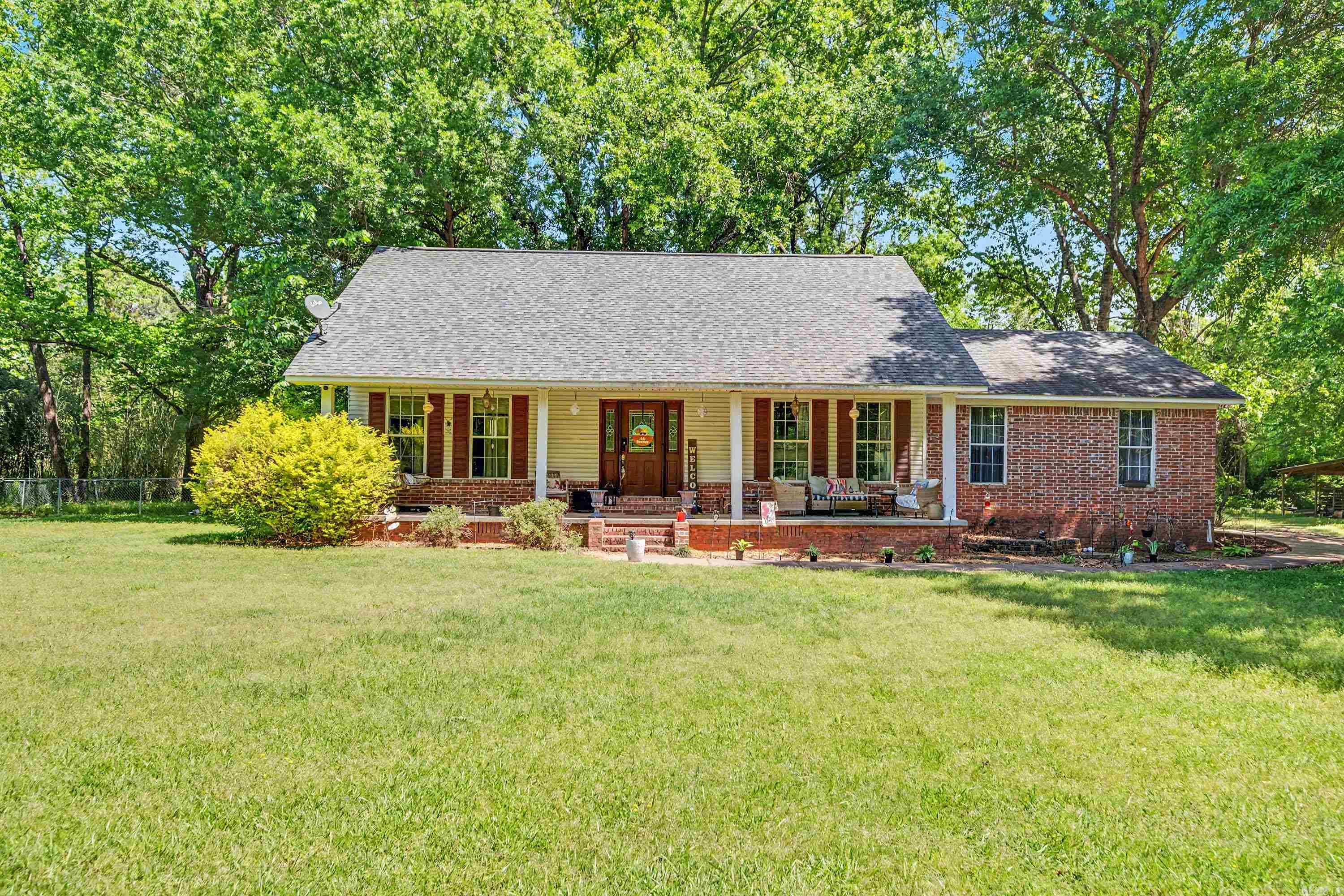 Welcome to your new home on approximately 1.8 acres (1.25 w/ house and .55 behind) with the space and privacy you’ve been looking for. The fully fenced backyard is great for pets, kids, or just enjoying the outdoors, and the screened-in back porch is perfect for morning coffee or relaxing in the evening.12 Wintercreek offers a flexible 4-bedroom layout. Three bedrooms are on the main level, including a primary suite with a spacious private bath and walk-in closet. Upstairs, you’ll find a fourth bedroom or bonus space. The oversized lot gives you plenty of room to spread out, and the long driveway provides easy parking for guests. Convenient access to Hwy 89, 365, and the interstate keeps you connected while still enjoying a more peaceful setting. Please note the property is located in a flood zone and may require flood insurance. Agents, please see remarks.