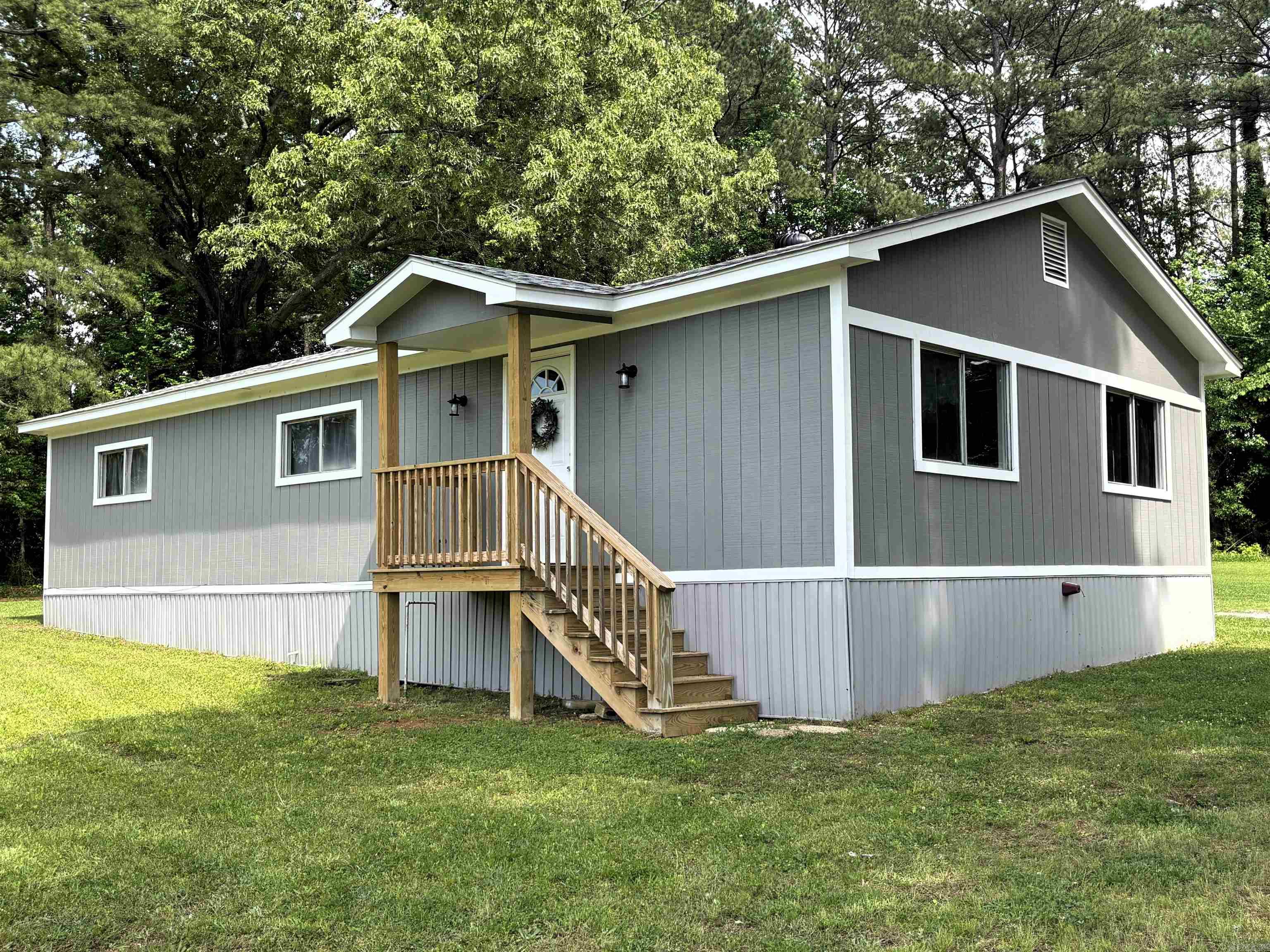 Beautifully renovated home in a great location—perfect for a family! The owner has taken this property down to the studs and completely transformed it with quality upgrades throughout. Age of trailer is unknown, but it was entirely redone in 2025.   Features include new plumbing, roof, HVAC system, electrical, LVP flooring, cabinets, and more. This home is truly move-in ready and offers a spacious yard with room for a garden. No restrictions provide added flexibility.  The home is all-electric, with natural gas available if desired.  Important: This property does not qualify for traditional 30-year financing options such as VA, FHA, or RD loans.  Buyer will need 15%-20% amortized for 15 years, all depending on buyer's credit and lender terms.