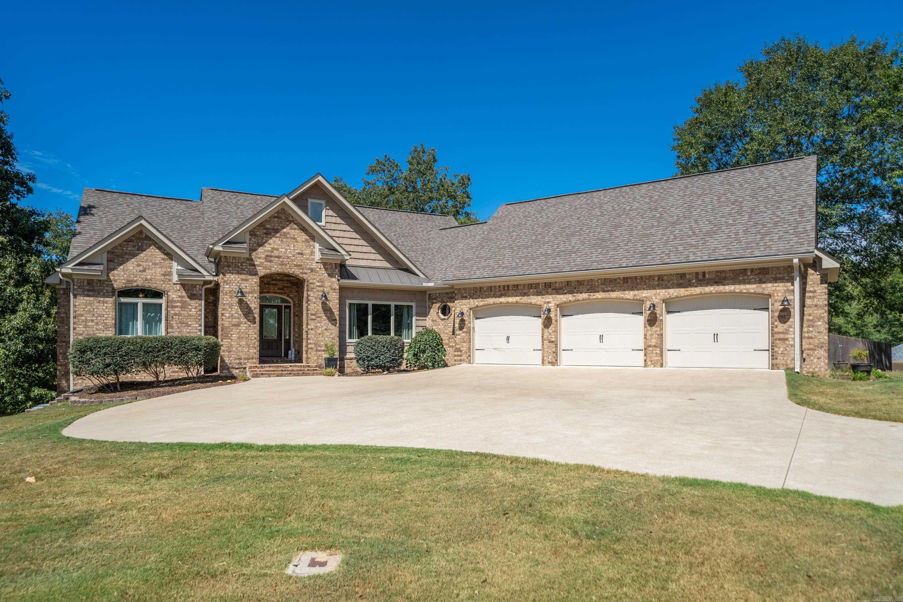Nestled on 1.7 acres, this custom 4-bedroom, 3-bathroom sanctuary embodies serene luxury. High ceilings and large casement windows invite natural light into every room. Step outside onto two covered porches or the covered patio, where you can unwind and watch deer roam amongst the lush trees. The spacious 26-27 foot deep three-car garage is a standout feature, complete with a dog shower. Outside, you will find a dedicated dog yard for your furry companions. Safety and convenience are paramount, with a spacious safe room, 6-inch exterior walls, and a whole-house generator. Just 3.5 miles from Lakeside School, this peaceful neighborhood offers generous yards, creating a haven of tranquility within easy reach of city amenities. Don't miss the opportunity to make this custom-built dream home your very own.