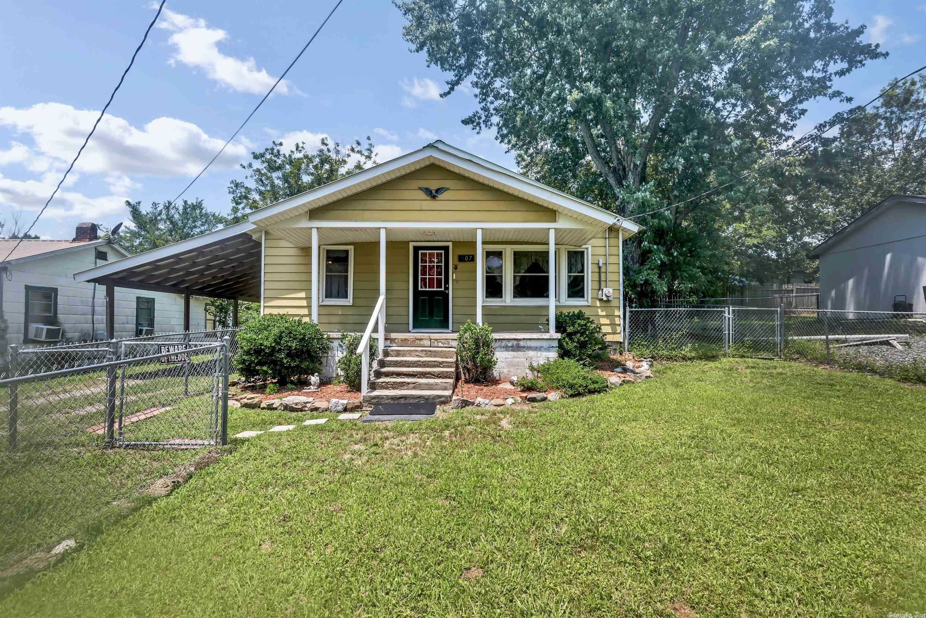 This home belonged to and was personally lived in, maintained and cared for by the oeners for over 40 years! It's never been a rental!  Nice 2 bedroom 1 Bath Home on .22 acre lot conveniently located in the charming area of Mena, Arkansas. This is a 944 sq ft Home has lots of updates with 2 bedrooms and 1 bath w/ large laundry room! The house has new interior paint, nice counter tops & cabinets, new carpet in bedrooms and low maintenance siding, metal roof and updated windows! House has a nice carport and Fenced in yard front and back! This place has lots of storage! There is a nice 10x16 building in the backyard that was used for a craft room & has window AC! It has electric and finished walls. There is also a large 16x20 Shop in the backyard This will make a nice primarily home or a great investment property- lots of potential! You are not far from Fishing, UTV riding, kayaking, mountain bike, hiking trails & many outdoor activities!
