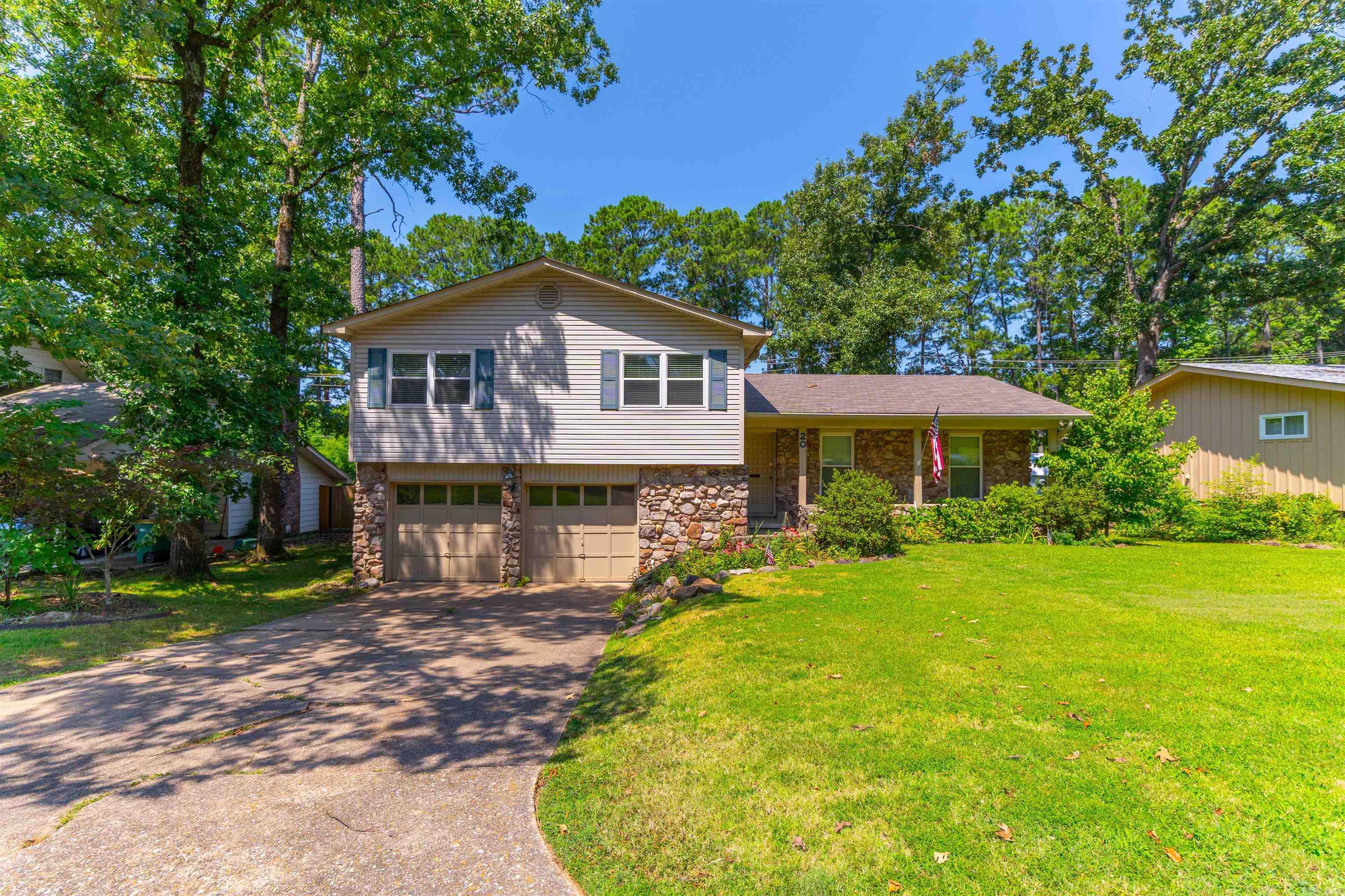 Welcome to your beautifully updated dream home in the heart of Little Rock! This spacious 4-bedroom, 2.5-bathroom residence perfectly blends modern updates with classic charm. Step inside to discover a bright, open floor plan featuring two distinct living spaces. The versatile second living area easily transforms into a game room, home office, or private media retreat to suit your lifestyle. At the heart of the home is the kitchen, boasting gorgeous wood cabinetry, ample storage, and a striking custom-made island perfect for meal prep and casual entertaining. Outside, the property features a fully wooden-fenced backyard, providing a private oasis for kids, pets, or weekend barbecues. With fresh updates throughout, this move-in-ready gem offers the perfect balance of comfort, style, and functionality. Schedule your private tour today!